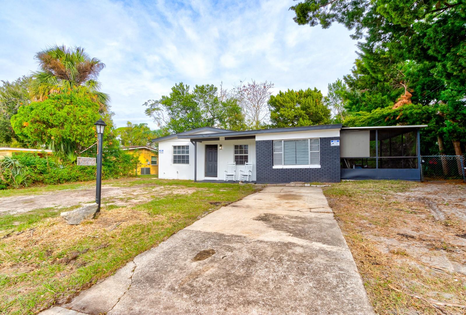 Welcome to this charming 4-bedroom, 1.5-bath concrete block home, perfectly located to present the best of Daytona living! This move-in-ready gem boasts fresh paint, new flooring, impact windows, and modern appliances. The laundry room doubles as a workshop, providing extra space for hobbies or storage. Step outside to a spacious yard surrounded by mature privacy trees! Best of all, there’s no HOA, giving you the freedom to truly make this home your own. Convenience is key, with close proximity to beautiful beaches, Tanger Outlets, Daytona International Speedway, and local colleges. Whether you're seeking relaxation, shopping, or adventure, this home places you in the heart of it all!