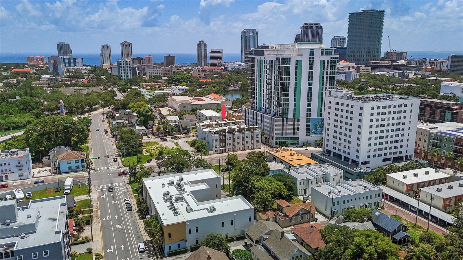 Welcome to Skye 333, a stunning modern enclave of 10 townhomes perfectly positioned in one of downtown St. Petersburg's hottest neighborhoods! This Energy Star Certified home in an X flood zone combines style, comfort, and security in one beautiful package.
Discover four levels of contemporary living with soaring 10-foot ceilings and a spectacular rooftop terrace. The first floor features a versatile bedroom and full bath—ideal for guests or a home office. Throughout the home, abundant windows flood each space with natural light, while custom blinds that retract from both top and bottom offer enhanced privacy and perfect light control.
Upstairs, the chef-inspired kitchen showcases custom cabinetry, elegant quartz countertops, LED lighting, premium stainless steel appliances, gas cooking, and a spacious breakfast bar. The generous primary suite includes his and hers walk-in closets and a luxurious bath with dual sinks. The guest suite offers comfort and privacy with its own ensuite bath.
Entertainment reaches new heights on the fourth-floor rooftop terrace with wet bar—perfect for watching fireworks and hosting memorable gatherings. Built for security, this home features predominantly concrete construction rated for 145 mph winds, hurricane impact windows and doors, plus smart home technology including Wi-Fi thermostat, smartphone app, garage door opener, Ring doorbell, and remote access locks.
Additional amenities include a two-car garage, secure gated access, tankless water heater, and dog run for your furry family members. Enjoy easy access to shopping, restaurants, parks, I-275, Gulf beaches, and Tampa.
Come start living your best life at Skye 333!