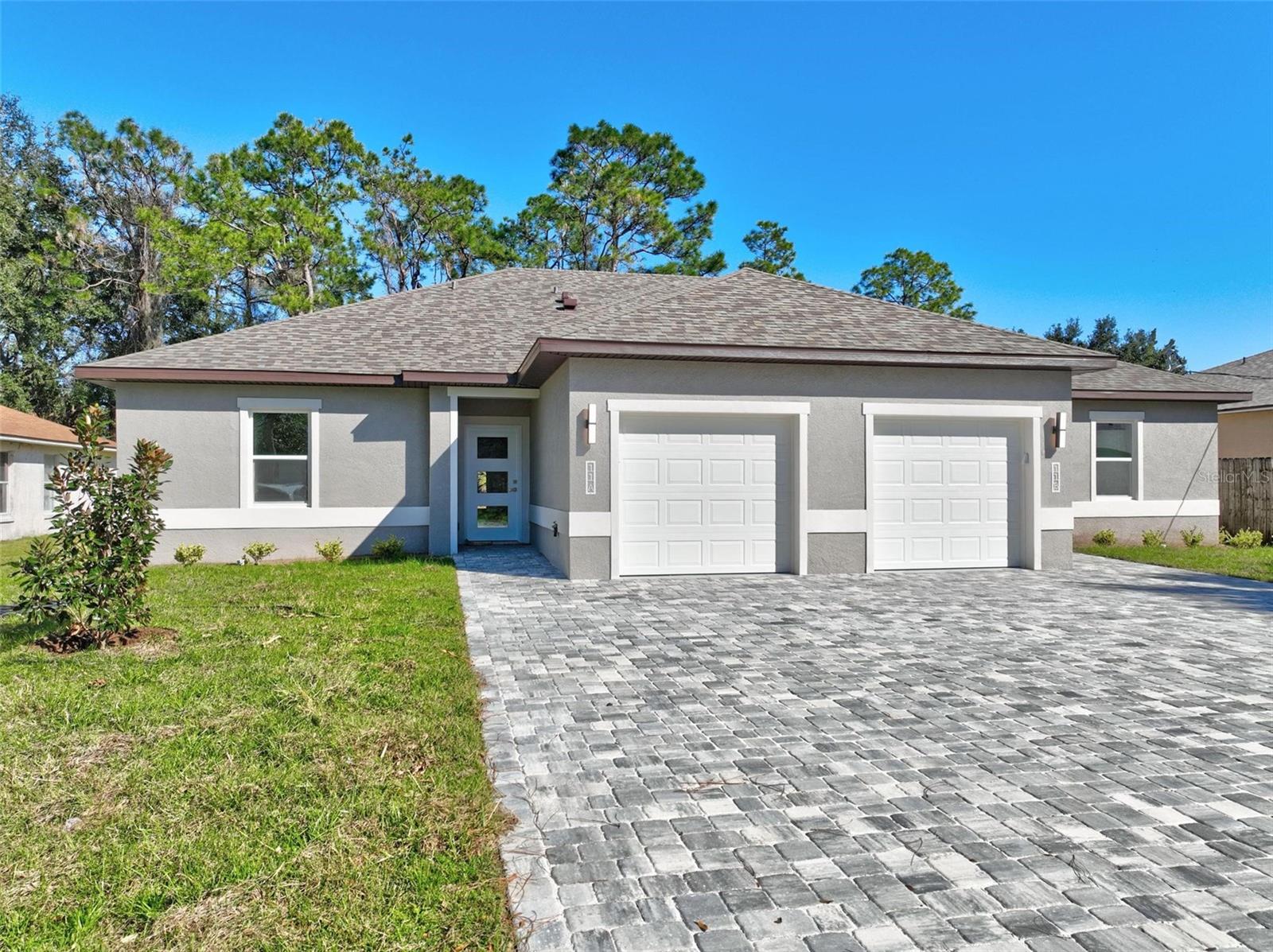 EXCELLENT INVESTMENT OPPORTUNITY! This newly constructed 2025 duplex offers a total of 3,316 square feet, featuring 6 bedrooms, 4 bathrooms, and a 2-car garage, located in the rapidly growing Seminole Woods Subdivision. Thoughtfully built with premium finishes and meticulous attention to detail, this property blends modern comfort, style, and functionality. Each side of the duplex features 3 bedrooms and 2 bathrooms, separated by a wall with enhanced sound insulation for optimal privacy. The kitchens are outfitted with stainless steel, energy-efficient appliances, 42-inch upper cabinets, and elegant granite countertops. Bathrooms include tile extending to the ceiling in both the master showers and guest baths, adding a refined, custom touch.Stylish and durable luxury vinyl plank flooring flows throughout the entire home—waterproof and scratch-resistant to stand the test of time. The property boasts 10-foot ceilings, with tray ceilings in the living areas and primary bedrooms, as well as modern light fixtures and ceiling fans with integrated lighting in all bedrooms.Additional features include:Tankless water heaters for energy efficiency and on-demand hot water. Separate electric and water meters for each unit, providing owner flexibility and tenant convenience. A four-car-wide paved driveway, offering a clean aesthetic and longer lifespan compared to traditional concrete. Perfectly located—just minutes to shopping, schools, AdventHealth Hospital, and less than 15 minutes to Flagler Beach. Enjoy easy access to both historic St. Augustine (30 minutes north) and Daytona Beach (30 minutes south). With a gross monthly rental income of $3,600, this is a rare and attainable investment opportunity you don’t want to miss!