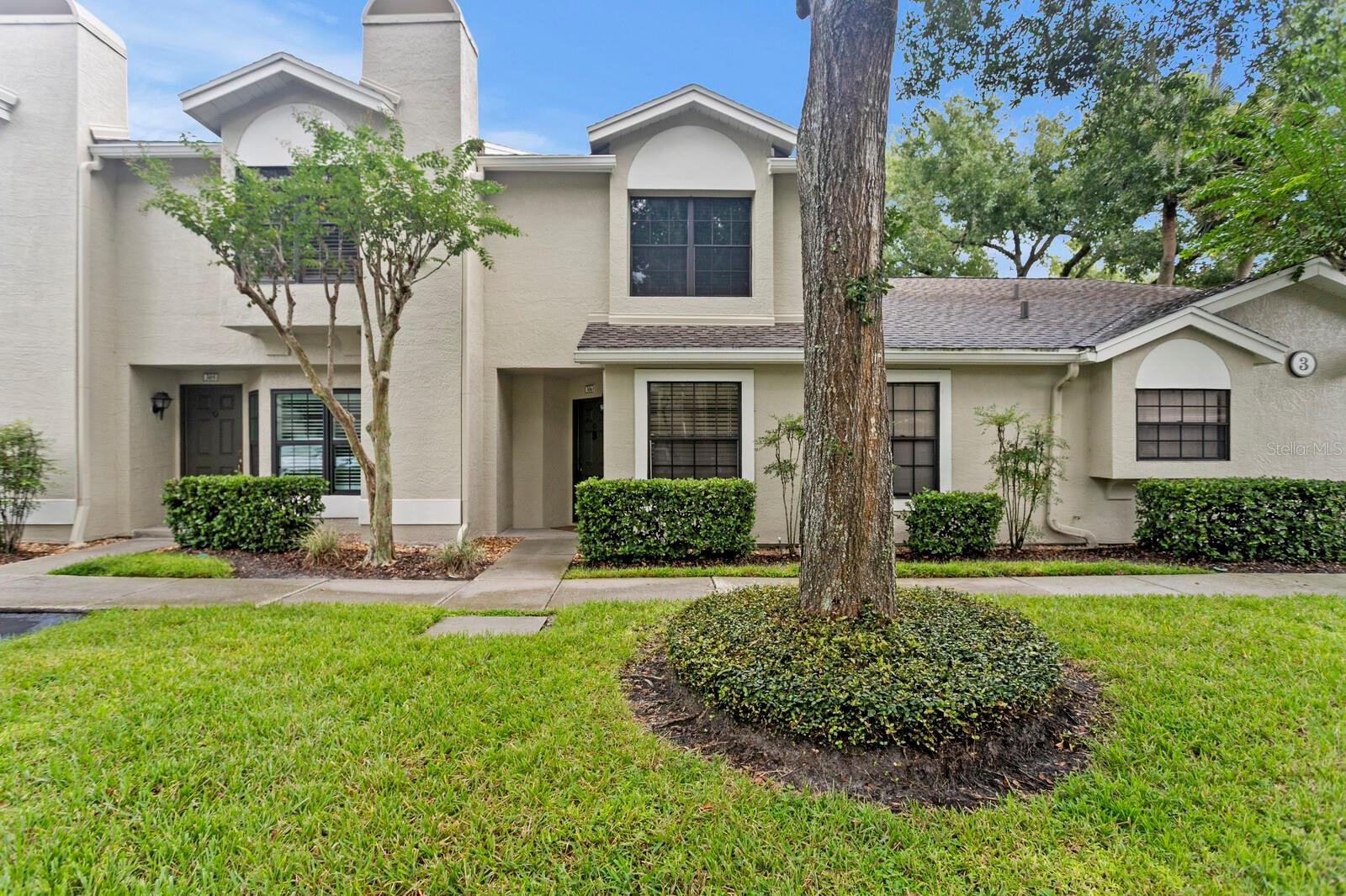 Maintenance-Free Living in Tampa Palms! Welcome to this updated 2-bedroom, 1.5-bath, home that features 1,121 sq. ft. of living space and plenty of upgrades including a newer HVAC!! This exciting new listing is located in the highly sought after gated community of Faircrest in Tampa Palms. The home opens to a bright, updated kitchen featuring white shaker cabinets, granite countertops, stainless steel appliances, and a roomy breakfast nook surrounded by natural light, perfect for morning coffee or tea. A convenient half bath is located downstairs for guests that offers updated granite countertops with white shaker cabinetry. The spacious great room is ideal for both living and dining, offering luxury vinyl flooring, modern recessed lighting, and sliding glass doors that lead to your private screened patio. Upstairs you’ll find two generously sized bedrooms, each with plenty of natural light. The primary suite includes a walk-in closet and charming window seat. The full bathroom upstairs features private two vanities with granite countertops and modern light fixtures, as well as a contemporary step in shower-tub combo. Relax on the screened rear patio that overlooks mature landscaping…the perfect place to relax after a long day. Faircrest offers a true maintenance-free lifestyle, with exterior upkeep, water, trash, and landscaping included. Enjoy the resort-style community pool, spa, fitness center, and clubhouse, all surrounded by beautifully maintained grounds. Tampa Palms also gives you access to additional recreational amenities, playgrounds, and nearby parks. This move-in-ready condo offers the perfect blend of comfort, convenience, and low-maintenance living in a prime New Tampa location. Close to i75, i275, USF, major hospitals, top rated schools, restaurants, shopping and more! You will love to call this place home!