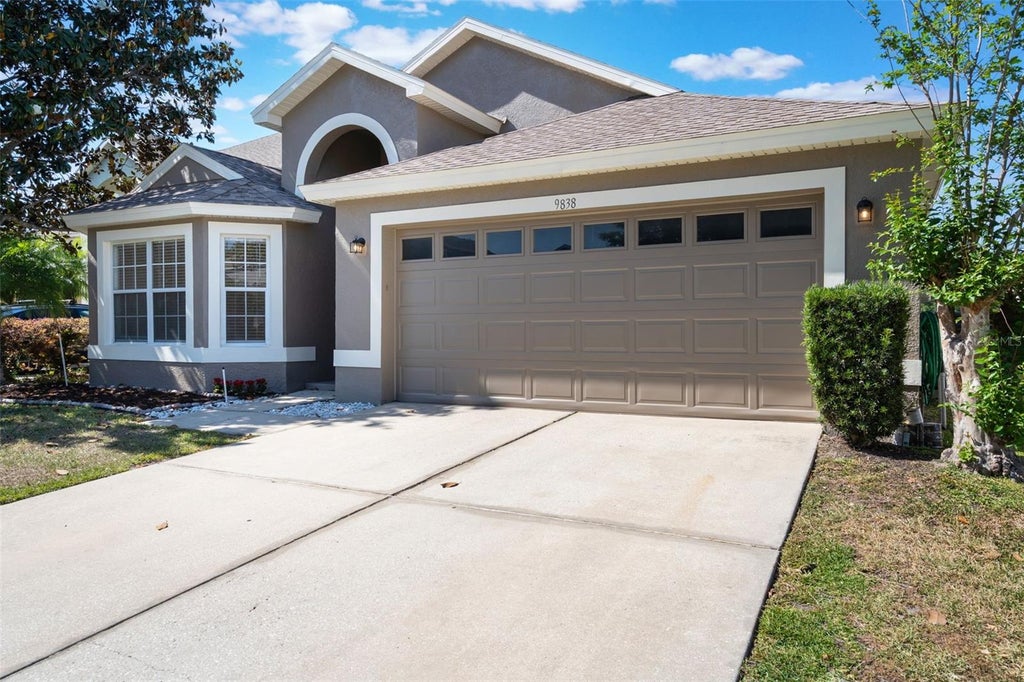 Photo of 9838 Pecky Cypress Way, Orlando, FL 32836 (MLS # O6448685)