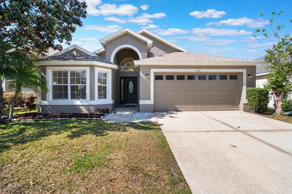 Photo of 9838 Pecky Cypress Way, Orlando, FL 32836 (MLS # O6448685)