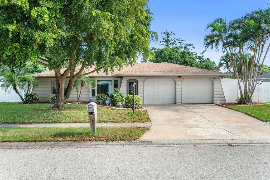 This spacious 3 bed/2 bath pool home with no HOA enjoys a split plan and a large fenced yard, with your own RV hook up and allows short term rentals! Nestled in the mature landscaping of this quiet neighborhood, you are just steps to all the shopping and restaurants you could want, while tucked in your own private oasis. The spacious living room boosts a bay window with custom blinds and 18in tile flooring. Your family and guests will love their roomy bedrooms with streaming light from the large windows. Their updated bathroom with granite counter features a walk in tile shower with dual shower head. With this split floor plan you primary suite is privately situated on the other side of the home and has its own slider to the screen enclosed pool deck and covered lanai. The en suite features a shower and tub, and you have ample storage with your lighted walk in closet. The kitchen boosts a breakfast bar, as well as dining space that opens to the lanai. Your interior utility room also has access to the side yard! The yard is fully fenced and features a hardee board storage shed with electric, as well as a full sewer and electric set up for your RV! The pool is screened in (updated in 2022) has a new pool pump and the lanai welcomes you to relax undercover, or hop in the corner spa and enjoy a soak! The handyman will love the expansive two car garage with work bench, and everyone will love the ease of the Florida lifestyle with no HOA! **Roof 2022 with transferable warranty. AC 2021 and 18in ductwork was added. Impact Windows (2020-3 front windows). Water Heater 2016. Irrigation system on shallow well with newer pump and cover. New color changing LED light in pool and newer pool pump with cover. Make this hidden gem your dream come true as your first home, your forever home, or your investment home!