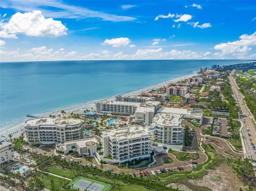 Discover the epitome of luxury living in this rare and expansive four-bedroom corner residence at the prestigious St. Regis Longboat Key. Designer-furnished by Inside Eye Studio, this home exudes sophistication and elegance. As you step off your private elevator, you are welcomed into a gracious living room complete with a custom-built privacy wall leading to the primary suite. The space boasts built-in features, including a bar with a beverage refrigerator and ice maker—perfect for entertaining guests in style. This residence features a spacious wraparound terrace that is a true outdoor sanctuary. The terrace is adorned with beautiful, lush plants that create an enchanting and private oasis while offering breathtaking views of the Gulf of Mexico and the resort's picturesque saltwater lagoon. A top-of-the-line Wolf grill adds to the charm, elevating your outdoor living experience.

The chef’s kitchen is a masterpiece, outfitted with Poggenpohl cabinetry and the finest Wolf and Sub-Zero appliances, including a double oven, gas cooktop, large refrigerator, microwave, and two dishwashers. A generously sized walk-in pantry ensures ample storage. The interiors, curated by Marc Michaels Interior Design, showcase timeless Wind finishes that harmonize with the home's exceptional style. Automated blinds add a modern touch, making comfort effortless.

The primary suite is a sanctuary of luxury, featuring a stunning wall of windows with panoramic views of the Gulf of Mexico and resort. The suite includes a spa-like bathroom with a soaking tub, a spacious shower, dual vanities, and two water closets fitted with Toto bidet toilets. Completing this retreat is a custom-built linen closet and a large walk-in owner’s closet. Each of the three additional ensuite bedrooms boasts private terraces and mesmerizing views of the city skyline, offering your guests a level of comfort they'll never forget. These spaces are beautifully complemented by porcelain tile floors, each 40 inches in size, adding a sleek and modern touch.

Nestled in the first branded residential community of its kind, this home integrates the legendary St. Regis amenities, including the signature Butler and Concierge services, an acclaimed St. Regis Spa, and in-residence dining options. Exclusive resident-only amenities such as a clubhouse, fitness center, pool, spa, and private beach area elevate your lifestyle even further. Indulge in a year-round vacation-like experience, where world-class luxury meets the serenity of Longboat Key.