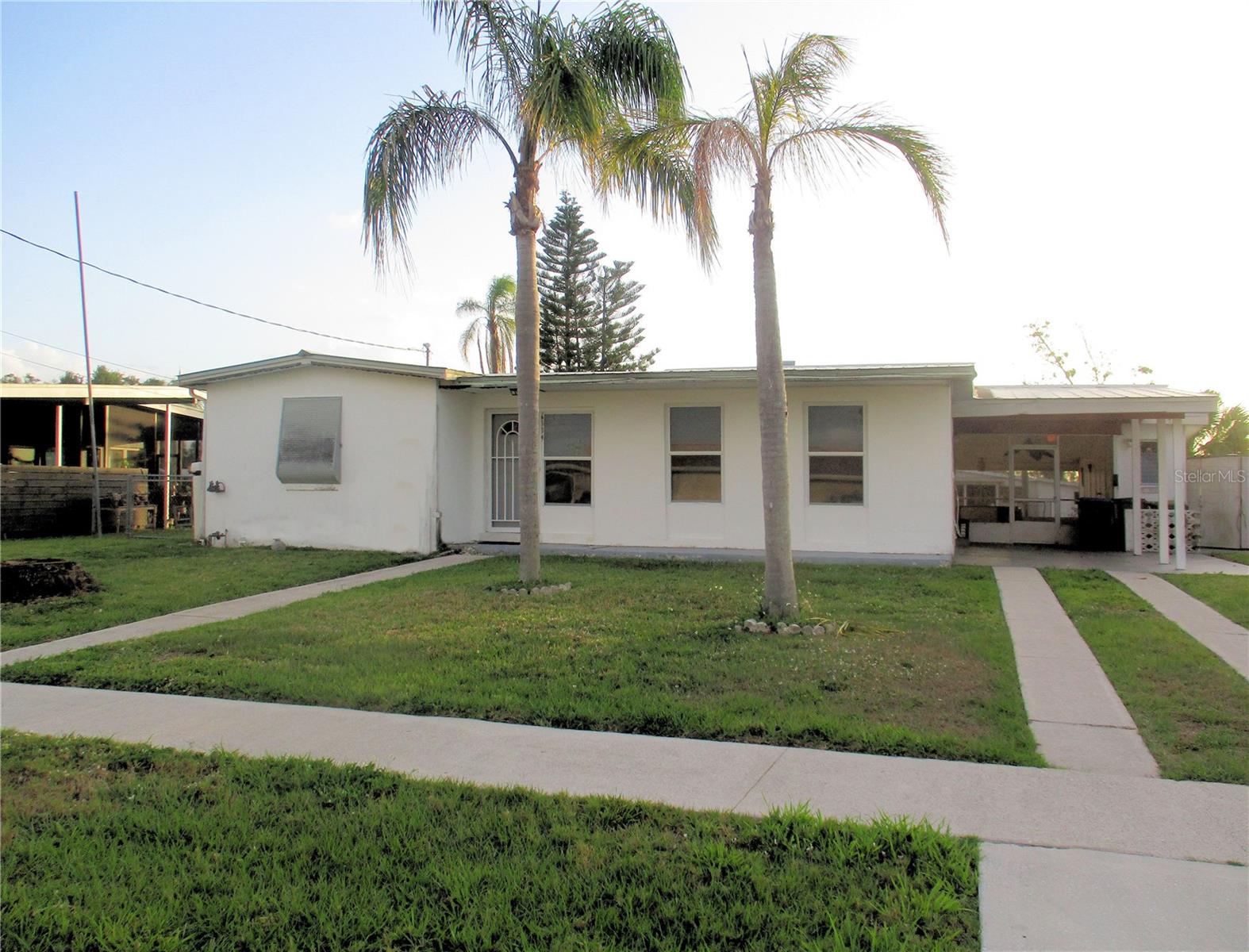 This is it! Your opportunity to live in Paradise AND perfect for remodeling to your vision of Paradise. This home offers 3 bedrooms and 2 baths, public water and sewer, new microwave and ceiling fans in bedrooms and living room Large lanai provides great sunset views, and the canal provides access via your boat to the Gulf with only 1 fixed bridge at El Jobean on SR776. Plus a new dock for your boat. Quiet neighborhood within minutes of dining, shopping, medical facilities (in January 2025 Sarasota Memorial approved the building of a new hospital in North Port), schools, parks, and recreation activities including beaches, boating, fishing, golf, bicycling, and the spring training facilities for the Atlanta Braves and the Tampa Bay Rays baseball teams. Minutes from Warm Mineral Springs. Conveniently located near U.S. 41 and I75 making visiting Sarasota, Tampa, St. Pete, Fort Myers, and Naples easy. Come take a look and start your adventure in the sunshine.