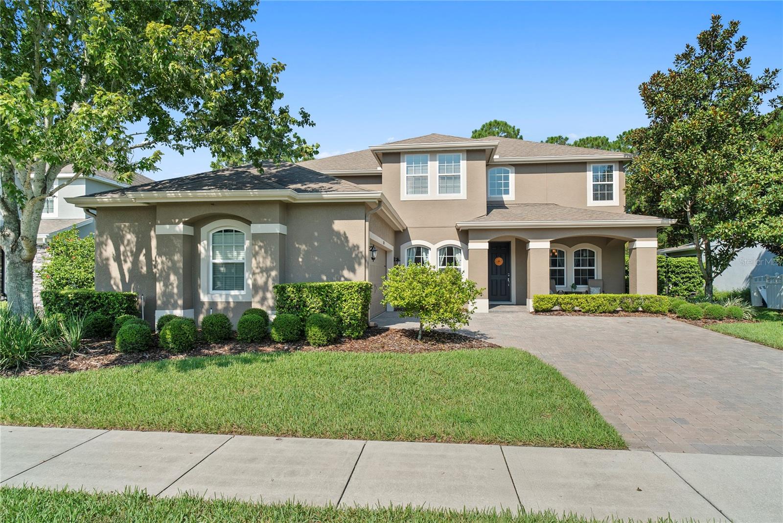 Welcome to the gated community of Reserve at Carriage Pointe, where sophistication meets comfort on a private wooded lot. Offering more than 4,100 sq. ft. of beautifully designed living space, this home delivers the perfect balance of elegance and everyday functionality.Step through the two-story foyer and you’re greeted by a formal dining room and a private home office with double French doors. The great room makes an immediate impression, with dramatic 18-foot ceilings and expansive windows that frame tranquil views of your resort-style pool and wooded backdrop. Designed for entertaining, the open concept flows seamlessly outdoors to your own private oasis.The kitchen is a chef’s dream—an oversized island, granite counters, walk-in pantry, breakfast bar, 42” cabinetry, and a gas cooktop make it as stylish as it is functional. The downstairs owner’s retreat is your sanctuary, featuring abundant natural light, dual walk-in closets, and a spa-inspired bath with dual vanities, a soaking tub, and a spacious walk-in shower.Upstairs, a generous bonus room and a media/flex room with double doors provide endless possibilities, while three additional bedrooms and two full baths offer space for everyone.Tucked away on a private wooded lot yet minutes from the 429 expressway, Winter Garden Village, Hamlin, Disney, and Downtown Orlando—this location is unmatched. Zoned for “A” rated schools K-12, including the new Windermere High School.If you’re searching for a home that truly has it all—space, style, and setting—this is it. Schedule your private showing today before it’s gone!