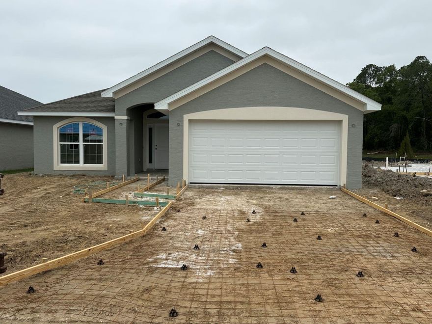 Under Construction. Estimated completion is May, pending any setbacks beyond builders’ control. Brand new 1820 sq ft, 4 bed / 2 bath home in a community with nature park/trails next door, easy access to I-75 and close to Ocala historic district, shopping, and dining. This home features tile floors in all areas except the bedrooms. Home also has granite countertops and shaker cabinets in the kitchen and bathrooms. Kitchen has a stainless steel range, microwave and dishwasher. Owner's bathroom has a large 5-foot wide tiled shower. Home also has TAEXX in-wall pest control system and a 10 year Builder Warranty. Community Center includes pool, fitness center, community room and playground!! Renderings are for illustration purposes only. Pictures are from similar home with same floor plan; colors and upgrades may vary. Please note that virtual tour/photos showcases the home layout; colors and design options in actual home may vary. Furnishings and décor do not convey.