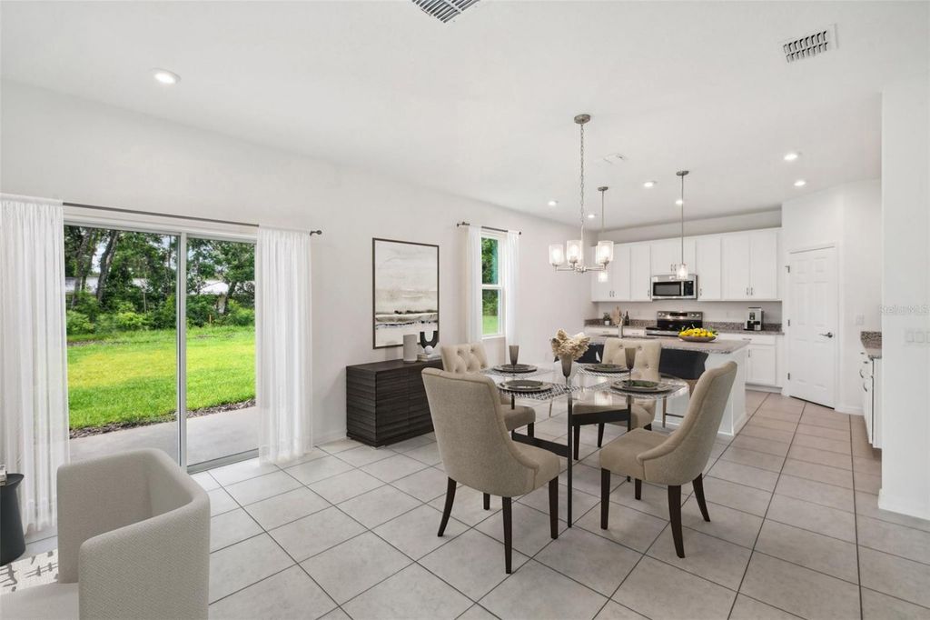 Photo of 12909 Trovita Drive, Grand Island, FL 32735 (MLS # O6364562)