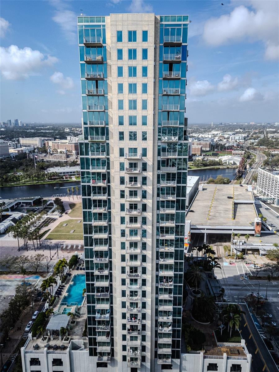 Experience the pinnacle of urban luxury living on the 19th floor of Sky point Condominiums, located in the heart of downtown Tampa. This stunning 2-bedroom, 2-bathroom home offers breathtaking views and an unbeatable location, just steps away from Tampa's most iconic attractions. Amalie Arena, Armature Works, the Tampa Museum of Art, Glazer Children’s Museum, and enjoy leisurely strolls along the Riverwalk and Curtis Hixon Park.
The open-concept layout is flooded with natural light from expansive windows, providing panoramic views of the downtown skyline. The expansive kitchen features sleek stainless steel appliances, perfect for cooking and entertaining. The primary suite boasts floor-to-ceiling windows that frame sweeping views of Tampa, while the attached en-suite bath features a double vanity for ultimate convenience. The second bedroom offers a separate full bath, ideal for guests or a home office.
Two secure parking spaces are included, ensuring peace of mind and convenience. Sky point offers a range of exceptional amenities to elevate your lifestyle, including 24-hour concierge service, secure access, a large pool and hot tub, an outdoor grilling station and bar, shaded pergolas, and a beautiful clubhouse with a catering kitchen. Stay fit in the on-site fitness center, which includes a cardio/weight room studio, and a lounge area complete with flat-screen TVs, billiards, and a home theater.
Sky point is ideally located near Harbour Island, Channelside, and Tampa General Hospital, with easy access to top restaurants, shops, and entertainment. If you're looking for luxury, convenience, and spectacular views, this is the place to be. Don’t miss out on this exceptional opportunity to live at Skypoint — where every detail is designed for your comfort and enjoyment.