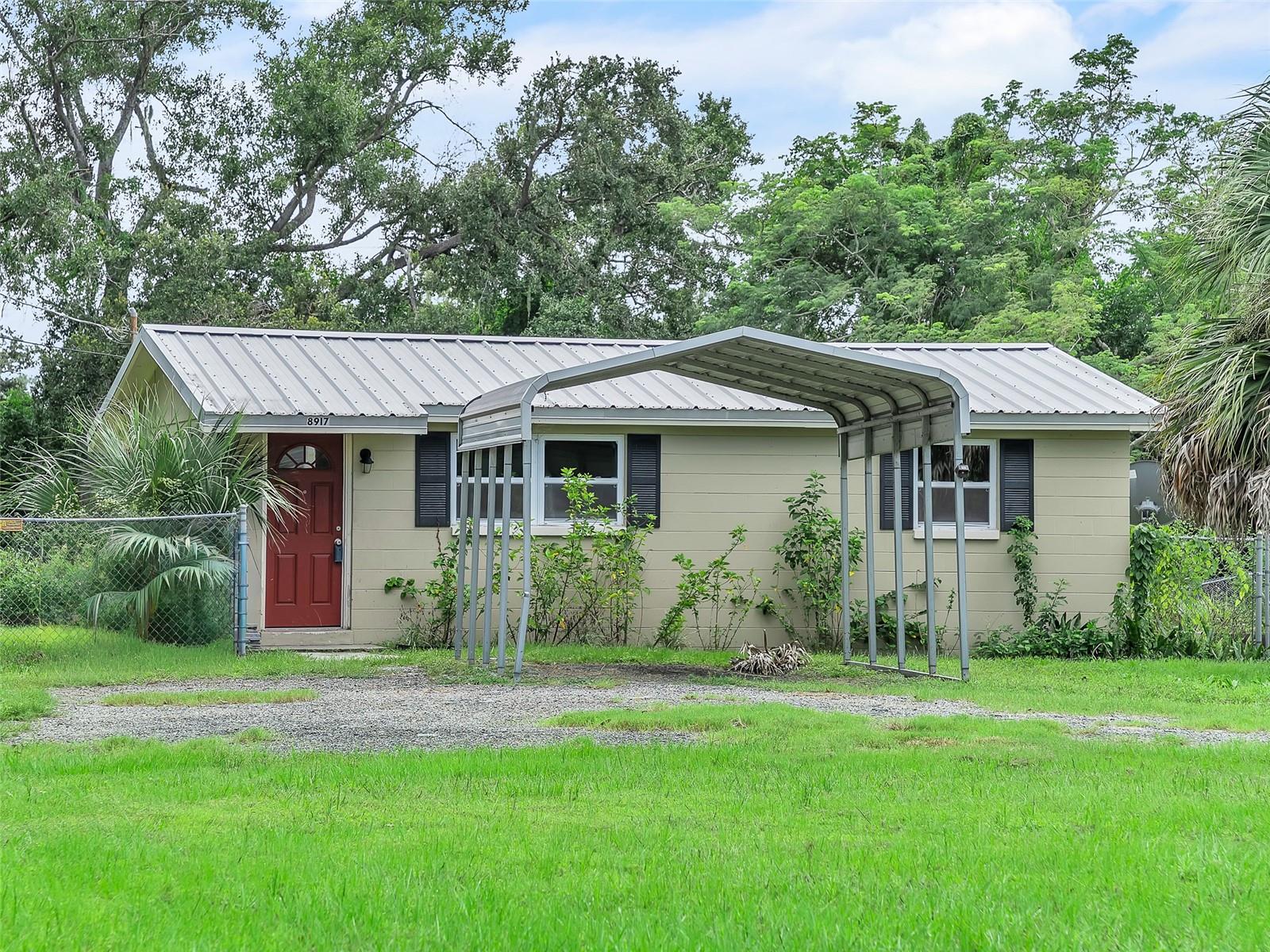 One or more photo(s) has been virtually staged. This is a needle in the haystack property, tucked way in Gibsonton. Non-Subdivision home on over a half-acre fully fenced property priced to sell at $250,000! Bring all your recreational vehicles, cars boats, rv to this property. Carport plus shed. Enter the home through the front door into the spacious living room. Down the hallway to the right are the primary and secondary bedroom. Off of the gathering room is the kitchen with a door to the backyard. The kitchen has lots of white cabinets, granite countertops and stainless-steel appliances. The remodeled bathroom has a white linen cabinet, white vanity with granite countertop and tub/shower combo. Luxury vinyl planking floors throughout the entire home. Plenty of room for a swimming pool or more structures. Extra Features-New Windows, Metal Roof.