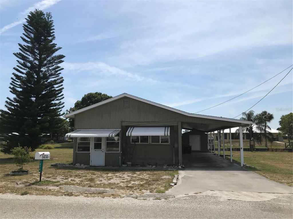 Photo of 1474 Lake Drive W, Okeechobee, FL 34974 (MLS # OK225136)