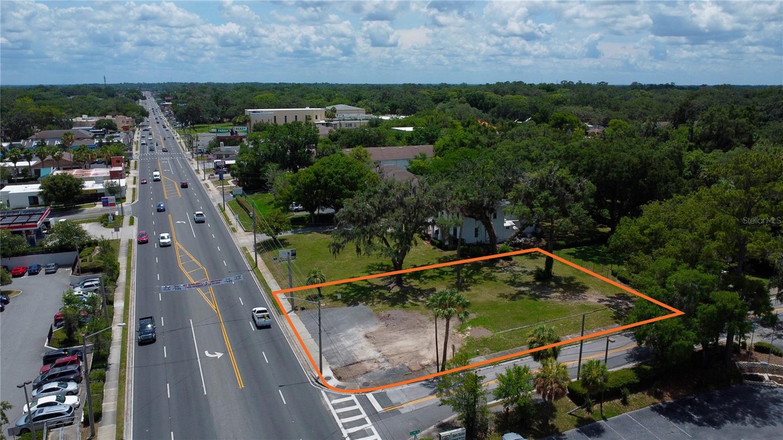 Hard corner on busy Hwy 40/Silver Springs Blvd. Just half a mile east of the historic downtown square and surrounded by QSR's like Checkers, Taco Bell, Zaxby's, Long John Silvers, and Pizza Hut. Numerous retail shops, professional offices, and strip centers are along this section of Hwy 40. Water, sewer, and electric to site (all utilities through the city of Ocala). Current structure will be razed shortly.