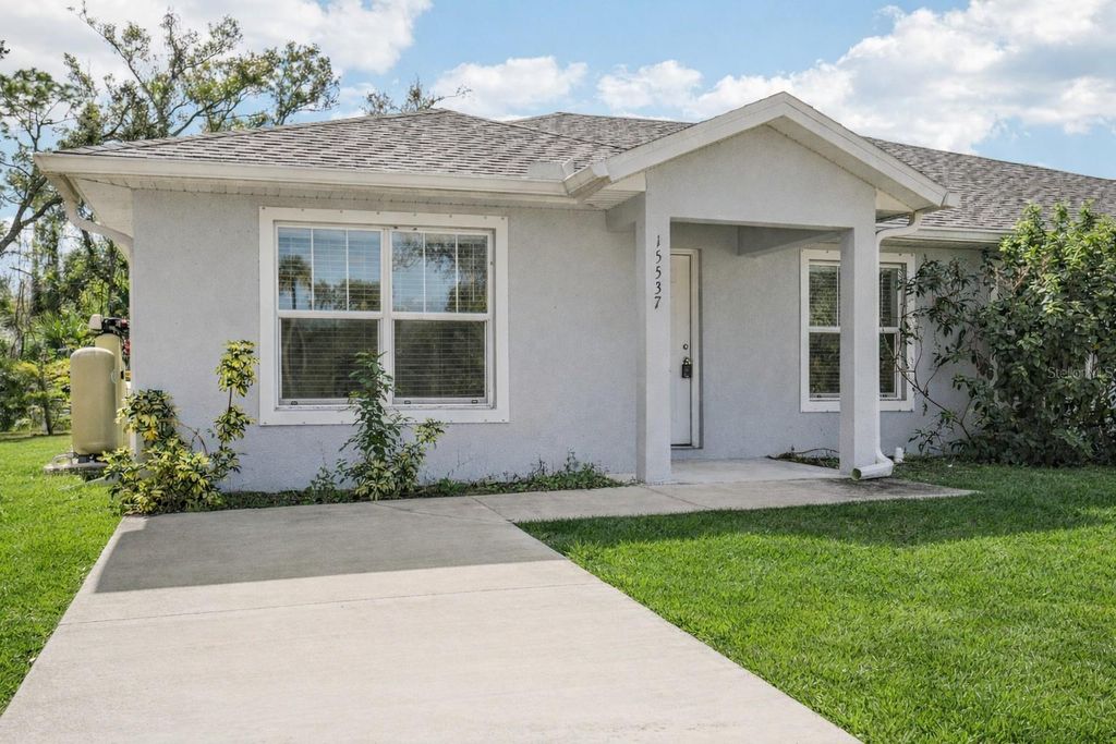 Photo of 15537 Buick Avenue, Port Charlotte, FL 33953 (MLS # OM717389)