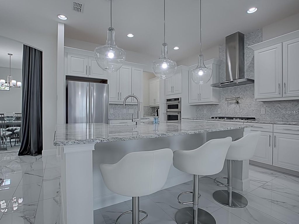 Photo of 7661 Toscana Boulevard, Orlando, FL 32819 (MLS # O6418841)