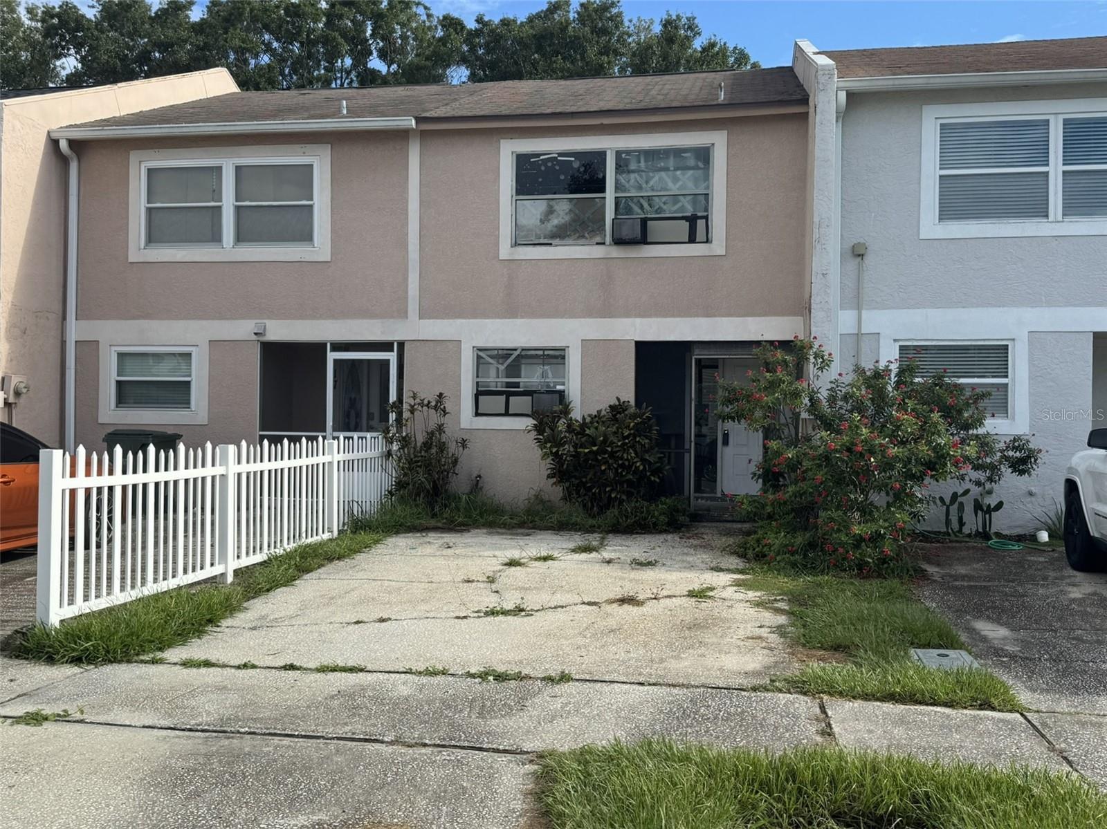 Short Sale. Here’s your chance to own in a well-located community with no HOA, no rental restrictions, not in a flood zone! This 2BR/1.5BA townhouse offers a smart and functional layout. The open living and dining area flows into the kitchen, creating a flexible main floor. Featuring large closets, upstairs laundry, and a large screened-in patio that opens to a private fenced yard. Needs updates throughout, priced accordingly! Solid opportunity for investors, or anyone looking to build sweat equity. Centrally located near major traffic arteries and just minutes to the Gulf beaches, don’t let this opportunity pass, you can be the one to snatch it up!