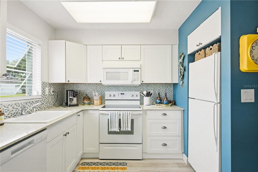 Photo of 854 Sky Loch Drive N, Dunedin, FL 34698 (MLS # TB8494802)