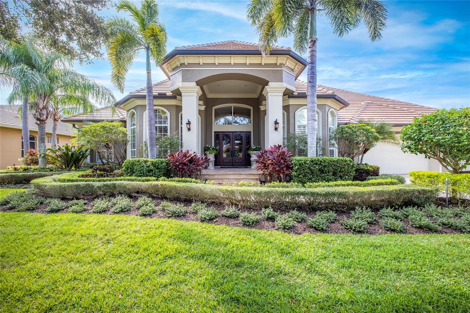 Under contract-accepting backup offers. NO FLOOD INSURANCE NEEDED! This home has been well-cared for, upgraded, and truly appreciated by its owners. You’ll notice the stunning, resort-style pool as soon as you walk through the front door. This beautiful, screened-in pool is accompanied by a built-in seating area and fire pit, a spill-over spa, and beautiful lighting and sprays. The double French doors open to the spacious covered patio and has a HUGE storage closet for your outside tools and toys. The outdoor grilling kitchen features a brand-new grill and has its own gas fire pit, in addition to the one in the seating area. All main areas of the home open to the pool, including the Family Room, Living Room and both Master Bedrooms. The lighting is all new around the pool landscaping and is on a timer. The veranda has its own gas fireplace and is a wonderful place to gather for holiday events or games – whatever you desire! The TV is newer and stays. The entire home overlooks the golf course and pond! This beautiful view of the water and 10th hole tee-off is seen throughout so much of this home. There is a NEW TILE ROOF 2022, 2 A/C units (both 2017) with Nest controls, New Garage door openers & tracks (very quiet), a New Laundry Room 2021 (including new Washer and Dryer), All New Exterior Lighting 2022, a New Water Softener 12/1/22, New Gutters around the entire home 2016, Ring Doorbell 2021, and much more. The primary Master Bedroom has a bonus area (14.5x5), that could be used as a newborn nursery, workout space, or even an office space. It has 2 separate walk-in closets with built-in cabinetry. The primary Master Bath has a Jacuzzi tub and large shower with built-in shelves and dual shower heads. It has dual sinks, surrounded by ample cabinet space. It also features built-in hampers! The Secondary Master is being used as a game room, with a pool table and TV that Sellers will leave in the home if the Buyers prefer. It has Newer Sliders and Windows, with remote-controlled shades. The Kitchen has beautiful stone countertops, a gas cooktop, a double built-in oven, an automatic microwave drawer, an ice maker, a water filtration system, and a massive, built-in pantry! Just wait until you open those doors! Usable cabinets wrap all the way around the island, providing ample storage! Do you love to gather the entire family for the holidays? This Dining Room will be your most appreciated piece! It is large enough to fit any table that you can find! There is a wine fridge and built-in drink drawers located in the pass through between the Dining Room and Kitchen – the perfect place! The 5th Bedroom is being used as the office with built-in filing cabinets, and a space in the cabinet that can house a mini fridge! It also features a large, walk-in closet that can easily transform into a closet designed for clothing if you decide to use it as a bedroom. A half bathroom is located just off of the office bedroom. The Sellers installed an underground drainage system in 2022 to prevent any drainage issues, and there is a deep well for irrigation. The 3-car garage is oversized and is equipped with overhead storage, as well as cabinet storage. You can truly park your cars AND store those holiday decorations! There is no other home in this neighborhood, or even in this area, that offers the upgrades and features that this home has! Join Bayou Club Golf to access pool, gym, & more!
