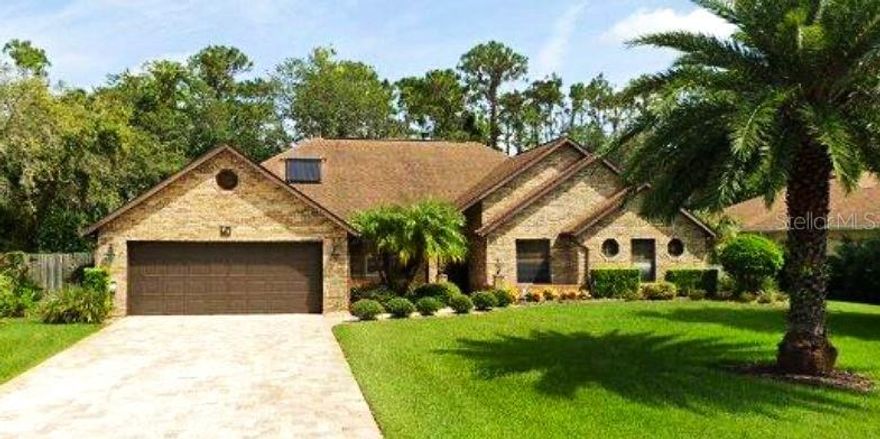 This lovely spacious home sits on almost a half-acre lot and is surrounded by mature landscaping and trees and bushes and greenery offering you a private oasis of peaceful space and serenity in one of the most sought-after communities in Ormond Beach.  Breakaway Trails is well-established and offers numerous amenities to their homeowners.  The HOA and Leland Property Management are knowledgeable and helpful in every way.  Their amenities include a lovely clubhouse with a pool, basketball courts, pickleball courts, a playground, a dog park and more.
With 4 bedrooms and 2-1/2 bathrooms, the layout and flexibility of space is never-ending.  The Master Bedroom (freshly painted) is huge and encompasses 2 walk-in closets and a large en-suite bathroom with a garden tub, separate shower and a tremendous amount of storage space.  The toilet is a separate and private area of the bathroom.  The 2nd and 3rd bedrooms are large and the 4th bedroom has been used as a den/office as it is a bit smaller.  The open floor plan is great for entertaining family and friends inside and the Florida Room (enclosed) and the tiled Patio allows the same vibe as they are both almost the length of the entire house.  The Florida Room is large enough to create an additional bedroom or office or play room.  It is totally surrounded by windows looking out to the large screened patio and the luscious expansive back yard.  Relax at evening time in your living room while sipping a glass of wine with comforting warmth from your wood-burning fireplace surrounded by brick stone.  Hang your Christmas stocking on the fireplace mantle.  Place your favorite treasures on the mantle to admire every day.  There are 3 sets of French Doors in this home, 2 lead from the Living Room to the Florida Room (and Patio) and 1 set in the Master Bedroom also leads outside.   Host dinner parties for your family in the formal Dining Room while enjoying the sunlight streaming in through the Bay Window and warming everyone at your table.  The Kitchen provides a lot of cabinets for storage and a built-in pantry with ample room for more than one chef.  The Kitchen cabinets (and bathrooms) have all been upgraded with pull-out drawers by Shelf Genie.  You will love these!  The Kitchen then leads to a cozy breakfast nook again surrounded by windows.
This traditional brick home features a new Roof, new Fascia, Soffits and Gutters, a new Hurricane-rated (5) Garage Door, a new Refrigerator, Dishwasher, and toilets & faucets.  Most importantly, living in Florida, the seller has purchased a WHOLE HOUSE GENERAC GENERATOR with 2 huge propane tanks for fuel to keep you safe and at home.  Rest assured you will be safe and secure during our storm season.  You deserve to experience Florida-living in a community that is convenient to highways, shopping, restaurants, churches, A-rated schools and all the beaches along the Atlantic Coast.  Daytona is a mere 20 minutes away!  This awesome private oasis is ready and waiting for you to call it "HOME."
