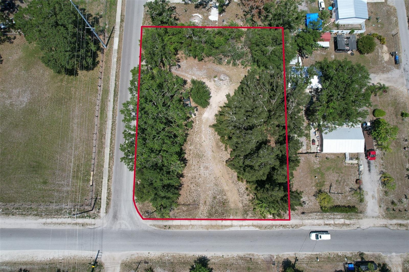 Opportunity Knocks! Oversized corner lot just over 1/2 acre. Build to suit or bring your own modular home (verify with zoning/county) ~ no HOA or CDD! Land has been appraised. Tax record has SELLERS name spelled incorrectly, correct spelling is NATHANIEL.