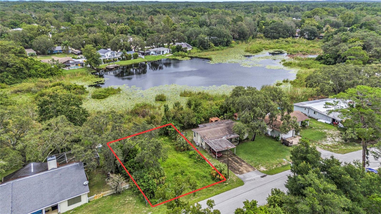 Affordable opportunity to own a 6,600 sq ft lakefront lot in Moon Lake Estates! Located on Clear Lake in New Port Richey, this residentially zoned property offers the perfect opportunity to create your own slice of Florida paradise - with no HOA restrictions. Enjoy peaceful waterfront views and the flexibility to design a home that fits your lifestyle. Conveniently situated just a short drive from downtown New Port Richey, you'll have easy access to local restaurants, breweries, boutiques, and entertainment. Spend weekends at Hudson Beach, explore nearby state parks, or take advantage of the many shopping centers and dining options just minutes away. Zoned for local schools and surrounded by nature, this lot offers the best of both serenity and accessibility. Don’t miss your chance to own prime lakefront property in a growing area - bring your vision and start building today!
