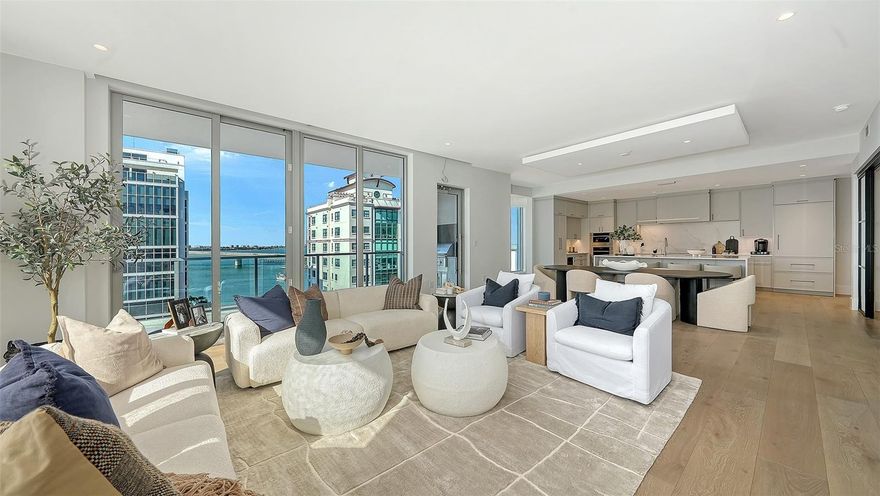 Newly completed, Peninsula Sarasota is ideally positioned in the coveted Golden Gate Point neighborhood, offering a peaceful residential retreat just moments from the vibrancy of downtown Sarasota. Designed by Blu Interiors, each residence showcases contemporary modern elegance with calming, sophisticated palettes, soaring ceilings, and expansive wraparound terraces that seamlessly blend indoor and outdoor living. Every element reflects a thoughtful commitment to refined luxury.

State-of-the-art kitchens feature sleek European cabinetry, gas cooktops, and quartz countertops, complemented by premium Wolf and Sub-Zero appliances. Additional highlights include hardwood flooring throughout, floor-to-ceiling windows that flood the home with natural light, and a private terrace equipped with a gas grill—perfect for effortless entertaining. The spacious owner’s retreat serves as a true sanctuary, complete with generous walk-in closets, dual vanities, a soaking tub, and an oversized walk-in shower for spa-like relaxation.

Residents enjoy on-site concierge services and secure, access-controlled underground parking for two vehicles, including an EV charging station. A private foyer and dedicated elevator provide direct access to exceptional amenities such as a resort-style pool and state-of-the-art fitness center, while the elegant owner’s club room offers private wine storage for each residence. The communal rooftop terrace sets the stage for unforgettable gatherings, boasting sweeping panoramic and sunset views.

Peninsula Sarasota delivers a truly elevated lifestyle within a lush, tropical setting—just minutes from Sarasota’s celebrated arts, culture, dining, and award-winning beaches. A rare opportunity to experience sophisticated coastal living. Schedule your tour today!