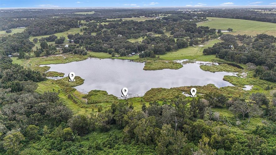 22.5 Acres (mol) on Lake Harrison – Build Your Dream Home in Dade City! Discover the perfect blend of privacy, natural beauty, and lakefront living on this stunning 22.5 acre property nestled along the shores of Lake Harrison in Dade City. Towering, mature trees create a picturesque setting for your future dream home, while serene lake views provide a tranquil backdrop for everyday living. With plenty of space to design your ideal estate or just enjoy the privacy of the land. This property offers many possibilities whether you envision a private retreat, equestrian estate, or a family compound. Escape the hustle and bustle while still being just minutes from the charm of downtown Dade City, local dining, and easy access to I-75 or the Suncoast Parkway! Lake frontage measurements are approximate.

Embrace the opportunity to build the lifestyle you’ve always imagined—right here on the water’s edge of beautiful Lake Harrison.