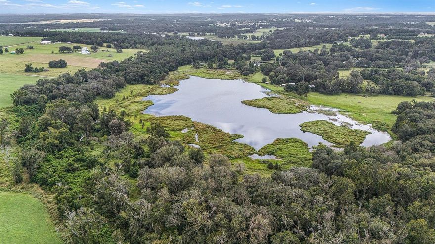 How about Owner Financing on this beautifull 22.5 MOL acres on Lake Harrison offering the ability to divide into three separate lots!! Less than $30K an acre! Whether you’re looking to build your dream home in Dade City or create a private three-home family compound, this exceptional property provides endless possibilities. Set along the peaceful shores of Lake Harrison, the land features towering mature trees, expansive open space, and serene lake views that create a truly picturesque setting. The generous acreage allows for privacy and flexibility—perfect for a private retreat, or Equestrian Estate. Enjoy the tranquility of lakefront living while remaining just minutes from historic downtown Dade City, local dining, and convenient access to I-75 and the Suncoast Parkway. Property consists of three separate lots being sold together. Lake frontage measurements are approximate.