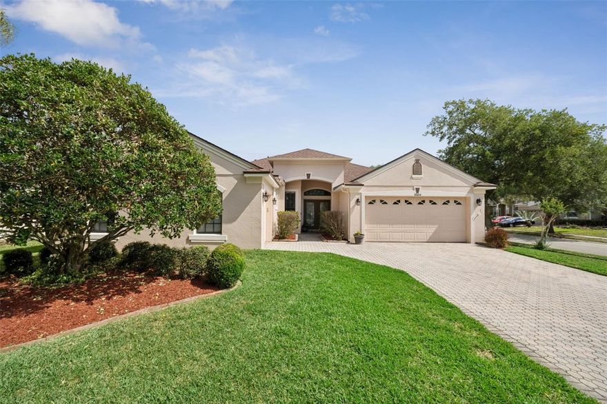 Welcome to your dream home in the highly sought-after Oviedo community of Live Oak Reserve, where luxury upgrades, modern design, and an unbeatable location come together. Perfectly positioned on a premium oversized fenced corner lot, this move-in-ready residence showcases standout curb appeal with a paver driveway, a split three-car garage and elegant double etched-glass French doors that create an unforgettable first impression. Step inside to a bright, open-concept floor plan featuring soaring 10-foot ceilings, rich crown molding, upgraded 5.5-inch baseboards, and a seamless blend of laminate and tile flooring throughout, complemented by luxury tile plank in the bedrooms. Every inch of this home has been thoughtfully maintained, delivering a refined yet comfortable living experience. The gourmet kitchen is ideal for both entertaining and everyday living, offering Corian countertops, abundant 40-inch cabinetry, upgraded appliances, and an effortless flow into the spacious family room. The primary suite serves as a true retreat with a relaxing garden tub, generous walk-in closets, and a dedicated vanity space designed for convenience and comfort. Three additional bedrooms provide exceptional flexibility, perfect for overnight guests, a home office, or creative spaces tailored to your lifestyle. Outside, you’ll find a screened-in patio that seamlessly extends your living space outdoors, along with a sparkling, heated, saltwater pool that creates the perfect setting for year-round relaxation and entertaining. Imagine starting your summer mornings with refreshing laps in the pool, unwinding in the Florida sunshine poolside, and hosting unforgettable evenings grilling and gathering with friends. Designed with both function and peace of mind in mind, this home includes new roof (2024), HVAC (2025), whole-home noise-reduction insulation, Cat 5 high-speed wiring, ceiling fans with remote controls, Pentair pool heater and a full security and irrigation system.  Living in Live Oak Reserve means enjoying resort-style amenities and access to top-rated schools, just minutes from University of Central Florida, Siemens, Research Park, premier shopping and dining, and convenient access to the commuter routes. This is a rare opportunity to own a fully upgraded, meticulously maintained home in one of Oviedo’s most desirable communities, offering the perfect blend of style, comfort, and convenience. Do not wait, call today to learn more!