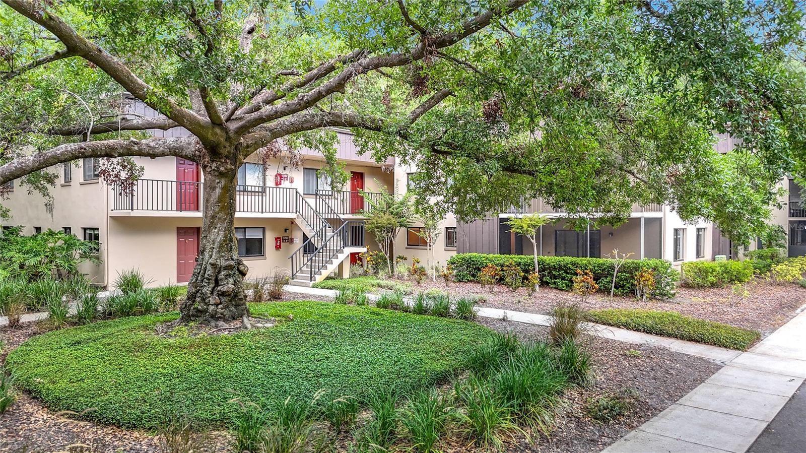 One or more photo(s) has been virtually staged. Price Improvement! Welcome home to Raintree Village, where peaceful, tree-lined streets meet unbeatable convenience. This stylish ground-floor, corner-unit 2-bedroom, 2-bath condo is move-in ready and waiting for its next happy owner. With nearly 1,000 square feet of comfortable, open-concept living space, this home offers a fresh, modern look with quality finishes throughout. As a CORNER UNIT, it provides extra privacy and natural light, while the GROUND-FLOOR location adds ease of access with no stairs to worry about. The updated kitchen offers plenty of cabinet space and room for casual dining, and both bathrooms have been refreshed for a clean, updated feel. The spacious primary suite features a walk-in closet and private bath, and the second bedroom offers flexibility for guests, a home office, or a cozy retreat. A brand- NEW AC unit ensures year-round comfort, and the IN UNIT WASHER AND DRYER make everyday living easy. Enjoy peaceful conservation views from your private screened patio, perfect for relaxing and enjoying the Florida weather.
As a resident of Raintree Village, you’ll have access to two sparkling community pools, tennis and racquetball courts, and beautifully maintained common areas that create a relaxed, resort-style atmosphere. Trash service is included in the HOA for added convenience. CENTRALLY LOCATED just minutes from USF, Moffitt Cancer Center, the VA Hospital, Busch Gardens, shopping, dining, and with quick access to I-275, this condo is ideal for first-time buyers, investors, or anyone seeking easy, low-maintenance living in a great location. Don’t let this one slip away. Some photos are virtually staged.