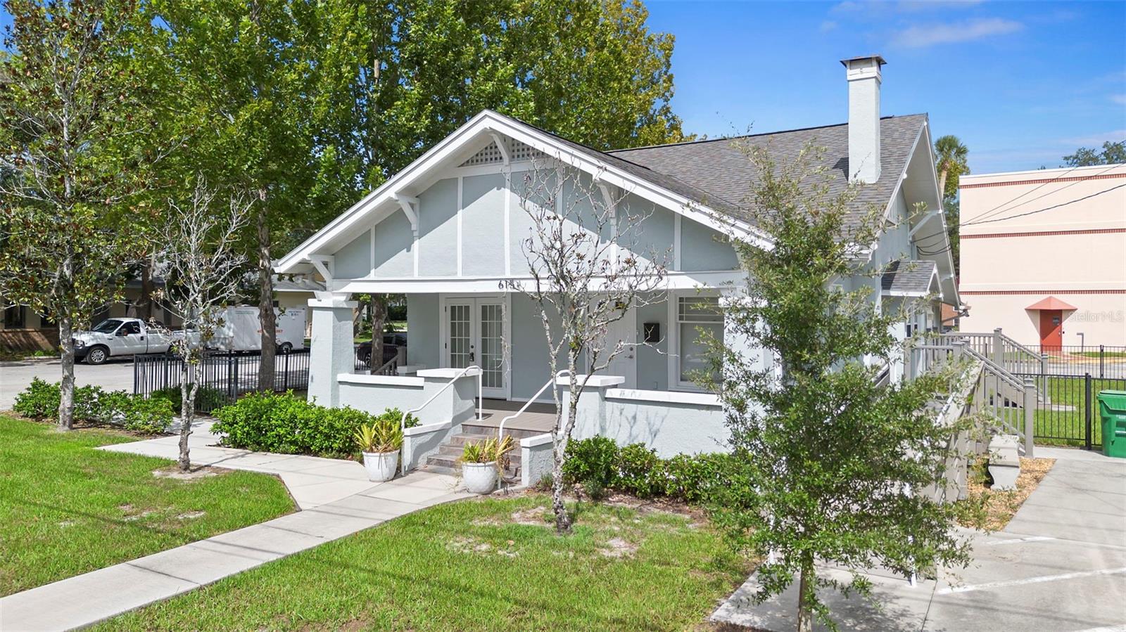 One of a kind property available in an incredible location! Situated adjacent to the DeLand Museum of Art campus and across the street from Stetson University. Just a few blocks from downtown and amongst some of DeLands most charming historic homes. This single family home has an E-1 zoning classification and was lightly modified for use as the Children's Art Center, later used for offices and has Modifications included two ADA bathrooms, an ADA parking space and ramp. The zoning classification includes such uses as singly family residence/rental, multifamily, educational purposes, daycare, student housing and many more. Beautiful wood floors, a spiral staircase to upstairs loft, fenced yard, and many updates completed. View the 3D tour and call to schedule a showing. (One or more photo has been digitally staged)