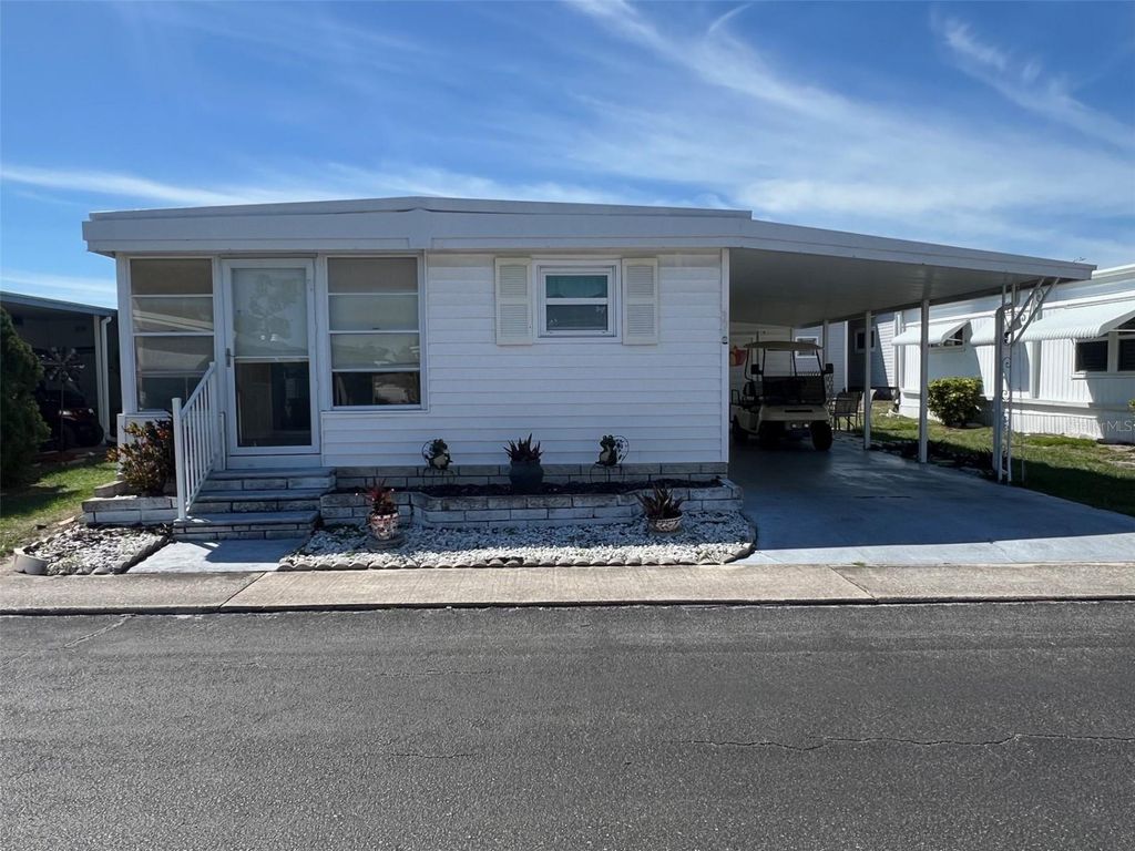 Photo of 37 Pindo Palm Street E, Largo, FL 33770 (MLS # TB8488637)