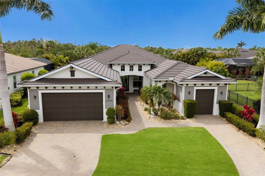 Tucked inside the gated waterfront community of Tidewater Preserve, this beautifully updated WCI Build boaters dream home offers a rare combination of privacy, outdoor living and thoughtful upgrades. Set on a quiet cul-de-sac homesite with no close rear neighbors, the property backs to expansive green space and conservation, creating a peaceful backyard setting that is hard to find. This spacious great room floor plan features 3 en-suite bedrooms plus a den/study, 3.5 baths, and 2,738 square feet of well-designed living space. The interior is light and bright, with sliding glass doors across the back of the home opening to an expansive lanai made for Florida living. The outdoor space is a standout, featuring a heated saltwater pool and spa, a large, covered lanai, and a fully equipped outdoor kitchen - ideal for entertaining, relaxing and enjoying the private backyard views. The golf cart garage adds valuable flexibility and makes a great storage area, home gym, or “Florida basement.” Inside, the home has been enhanced with meaningful upgrades that offer both comfort and peace of mind, including a new TRANE HVAC system, a 22kW Generac whole-house generator, quartz countertops and a water filtration system. Beyond the home itself, Tidewater Preserve offers an exceptional lifestyle with 24/7 gated security, a private marina with boat slips for rent, 3 community pools, fitness center, tennis courts, kayak and canoe launch, walking trails, dog park, playground and a beautiful riverfront clubhouse. A full calendar of community events led by the on-site lifestyle director adds to the neighborhood’s warm and welcoming feel. This is a rare opportunity to own a highly desirable home on one of the best homesites in Tidewater Preserve, with the privacy, layout, and upgrades buyers are looking for.