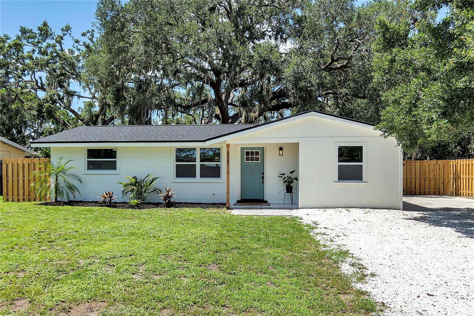 Welcome to this beautifully renovated 3 bed, 1 bath home, in the sought after Sarasota Springs, an HOA free neighborhood, where modern updates meet comfort and charm. Every detail has been thoughtfully upgraded, offering a move-in ready experience for its new owners. As you enter, you'll find the open living area and kitchen offering a bright and inviting interior with stylish finishes throughout, perfect for both relaxing and entertaining. Every room has been upgraded with all BRAND NEW hurricane impact windows installed 2025 which brings tons of natural light into each room. In every bedroom you'll find accent walls and ceilings, barn doors, as well as a walk-in closet with custom built-in shelving in the primary bedroom. Enjoy a BRAND NEW central A/C installed June 2025 with a 10 year warranty, along with a BRAND NEW roof installed May 2025, giving you peace of mind in Florida's unpredictable weather! The heart of the home opens to a spacious, fully screened 150 sq ft lanai—ideal for enjoying your morning coffee or hosting evening gatherings, all while staying protected from the elements. Outside, you'll find the perfect spot for a shed, along with a fully fenced-in, shaded backyard providing a safe and private space—ideal for your pets or creating your own outdoor oasis. With a refreshed interior and excellent outdoor features, this home offers the best of Florida living. Don’t miss your chance to make it yours!