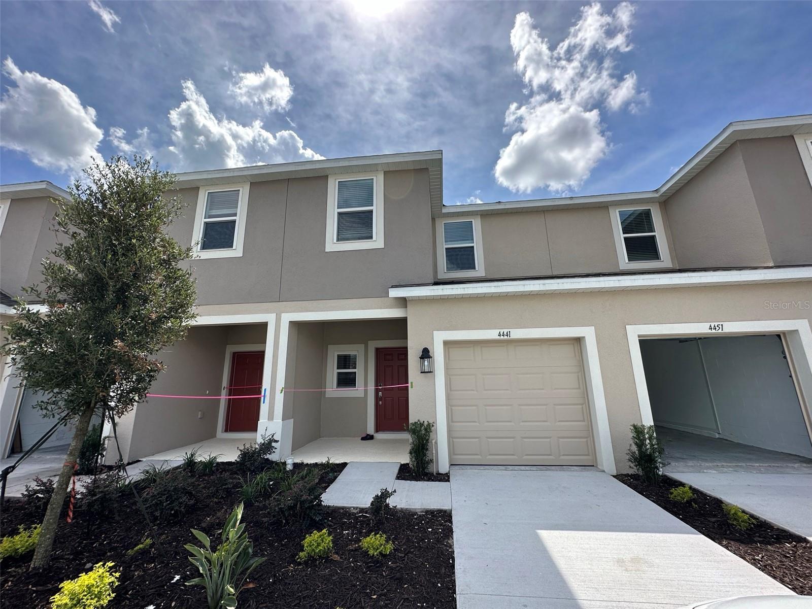 Newly Built! This stunning townhome in the desirable Anthem Park community of St. Cloud features three spacious bedrooms, two and a half bathrooms, and a beautifully designed kitchen with an oversized quartz island, complete with all appliances. Enjoy the added luxury of a large lanai, a one-car garage, and ample parking with a driveway and nearby public spaces. Perfectly situated close to major shopping centers and highways, this home offers unmatched convenience. Don’t miss this exceptional opportunity!