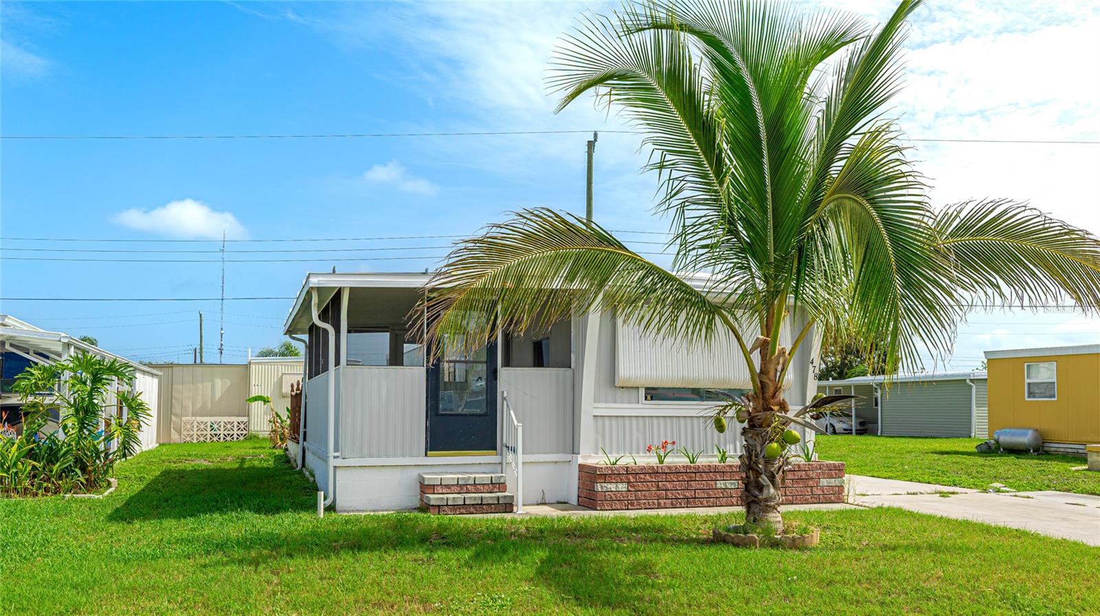 MOTIVATED SELLER! Located in desirable 55+ Leisure Lake Co-Op! NEW ROOF May 2025! 2024: new water heater. 2021: Newer remodeled kitchen, flooring & appliances. 2020: new windows. AC is 7 years old. Spacious split bedroom design with generous size bathroom that includes double vanity & walk in shower. Large enclosed porch for dining & entertaining. Enjoy the banana & coconut trees, a quiet street & plenty of space to add on to both sides of the mobile home. Bring your golf cart & your pet too! Community pool is salt water & heated. Amenities include pickleball, tennis court & shuffle board, fitness center, clubhouse, laundry & library. Active & pet friendly community with year round activities. Free shuttle to the Palmetto bus station & about a mile away to the 7-11. (Certain streets in Leisure Lake are pet approved & Church Road is allowed to have pets). Close to 275, 41 & 301, Walmart under 3 miles away & within an hour of 3 major airports: Tampa International, Clearwater/St Pete & Bradenton/Sarasota. LOW LOW HOA $212/mo includes mowing 1x week, water, trash, recycling & sewer.