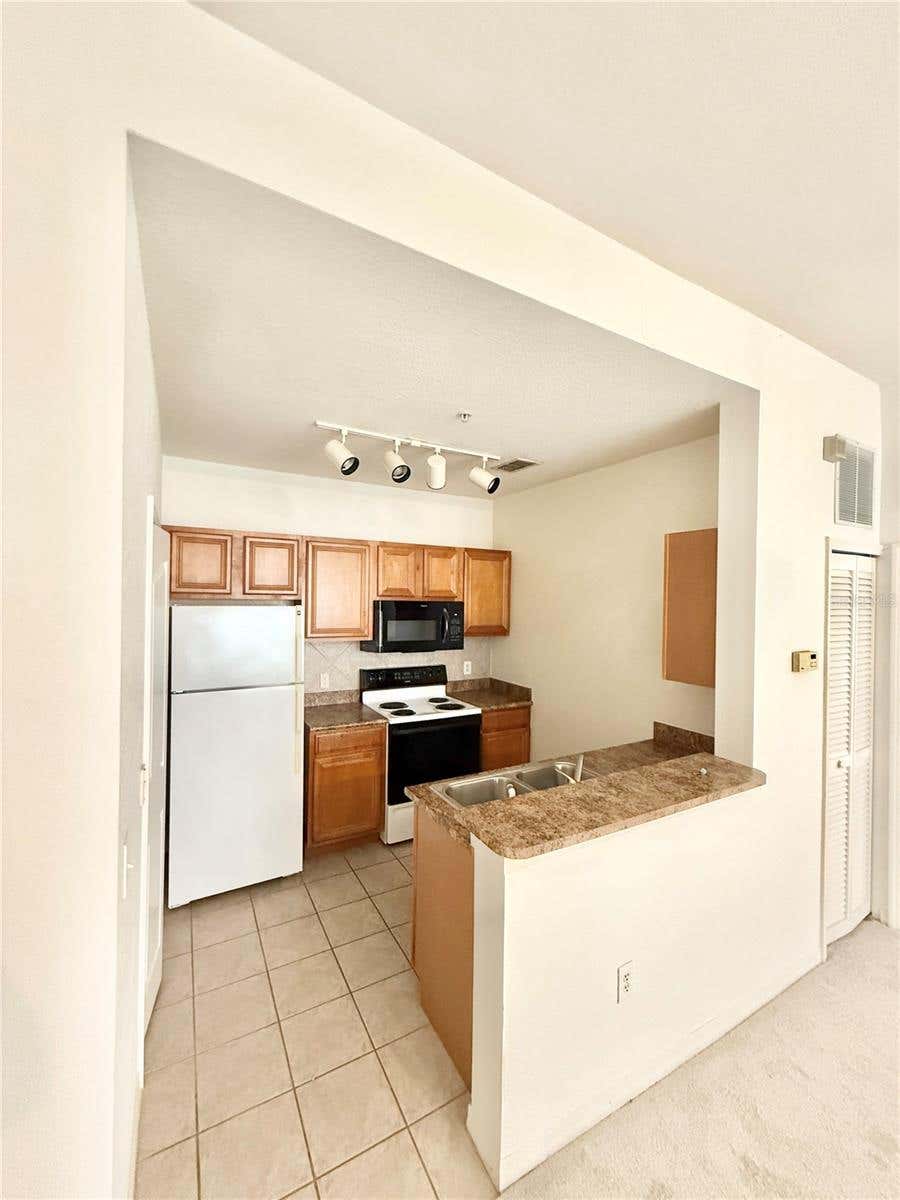 Photo of 6137 Metrowest Boulevard #306, Orlando, FL 32835 (MLS # O6417715)