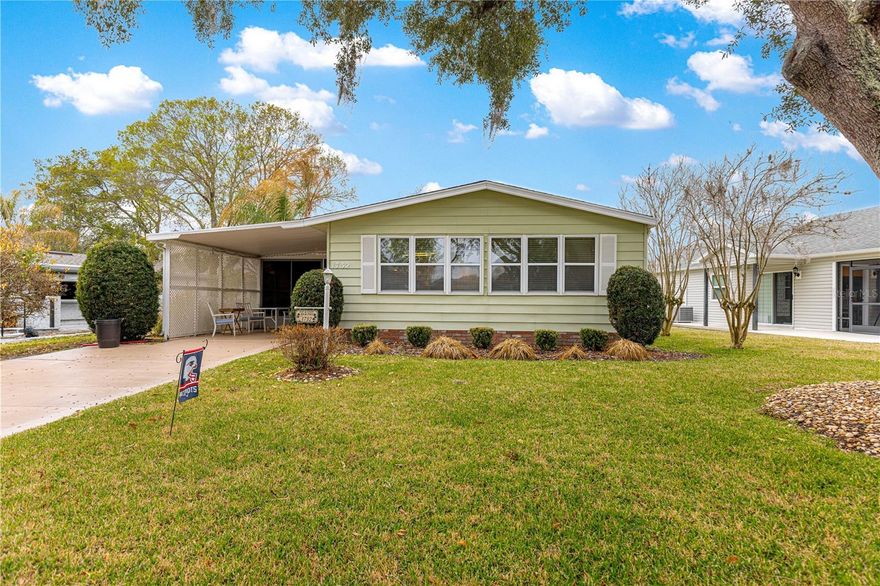 Start living The Villages® lifestyle today - TURNKEY - Well cared for 2 bedroom, 2 bath home - Located in Orange Blossom Gardens - NO BOND or CDD fees - NO CARPET - Roof 2020 - HVAC 2015 - Water heater 2024 - The home offers high ceilings and tiled floors in the kitchen, living and dining area - The Kitchen offers, a pantry closet, granite counter tops and plenty of storage with built in cabinets- The living area has an electric fire place, built in bar - perfect for entertaining friends and family - The primary bedroom offers laminate flooring, a walk in closet, ensuite bathroom with a step in shower - The guest bedroom has laminate flooring, ceiling fan and a closet - The guest bath has a tub/shower combo with a grab bar - The lanai is enclosed with a ceiling fan - Located near Orange Blossom Hills Golf and County Club, shopping, UF Health Villages Hospital, Spanish Springs Towne Square® - pickleball, arts crafts, exercise classes are just a golf car ride away-