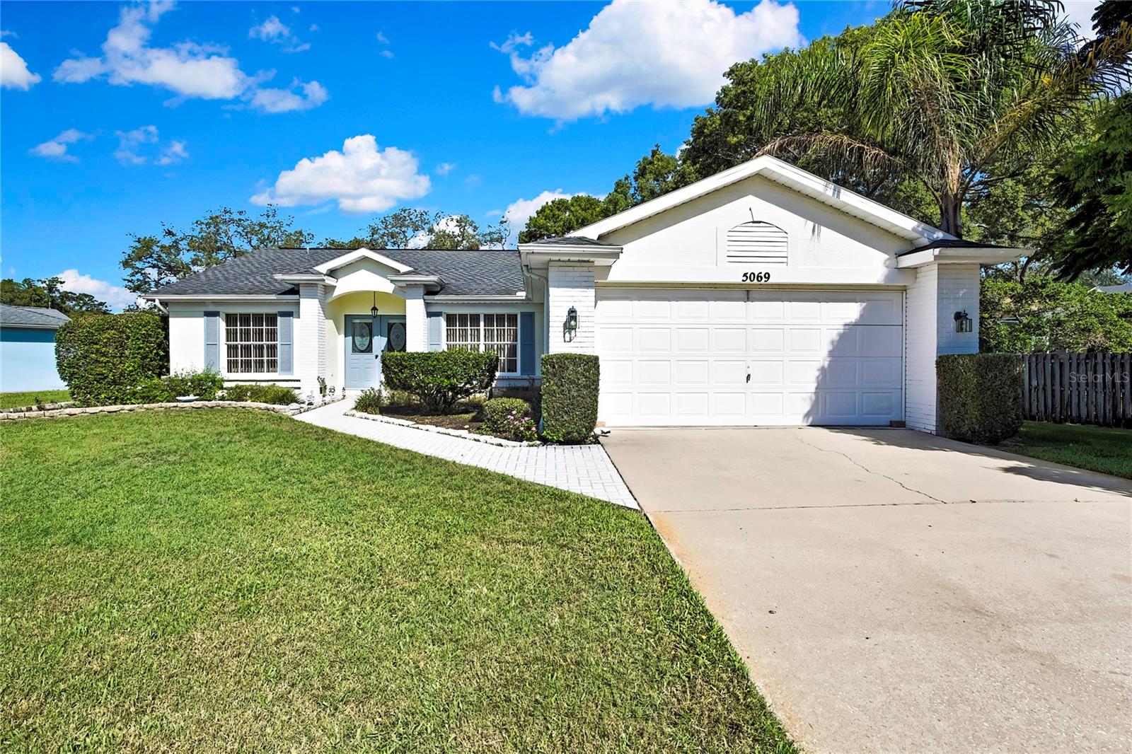 Welcome to this charming, well-loved 2-bedroom, 2-bath home in the sought-after Regency Oaks community—a perfect opportunity for buyers seeking a move-in ready residence or a home they can thoughtfully update and make their own. Owned and cared for by just one family over the years, this home exudes warmth, comfort, and potential.
With 1,385 square feet of living space and vaulted ceilings, the home feels bright, open, and more spacious than its footprint suggests. A 2-car garage offers ample storage and convenience, while the irrigation system, which runs on well water, helps keep your landscaping lush with minimal impact on your water bill.
Set on a unique cone-shaped lot, the property offers a rare sense of privacy with no immediate backyard neighbors, making it ideal for those who enjoy a peaceful, outdoor setting.
Location is key, and this home delivers—with shopping, dining, and everyday conveniences just minutes away and easily accessible without ever needing to get on US 19. Whether you're running errands or meeting friends for dinner, you'll love the ease and accessibility this neighborhood provides.
As a resident of Regency Oaks, you'll also have the option to join the Civic Association for just $125 per year, which grants unlimited access to the community clubhouse, pool, and tennis courts—perfect for both relaxation and recreation.
Whether you're a first-time buyer, downsizing, or simply looking for a well-maintained home in a peaceful, well-connected neighborhood, this gem offers the perfect blend of 'cozy,' value, and opportunity.