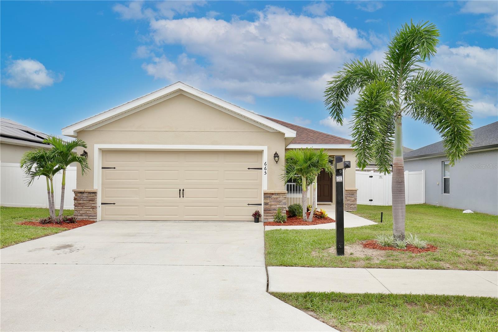 This property offers an exceptional living experience with 3 bedrooms 2 bathrooms and a 2 car garage. Located in a convenient and well maintained neighborhood, this home is ideal for those seeking a perfect blend of comfort and style. Upon entering, you'll be greeted by laminated floors that add warmth and elegance to every corner. The house features an open concept design that seamlessly connects the living room, kitchen, and dining area, creating a welcoming space perfect for family living and entertainment. The kitchen is equipped with modern stainless appliances and spacious countertops, ideal for kitchen enthusiasts. The open layout allows for a smooth transition between areas, facilitating interaction among family and guests. The exterior of the house contains a beautiful side patio that invites you to enjoy outdoor grilling and relaxation. This Davenport home is 2 minutes away from popular restaurants, shopping, and home improvement stores.