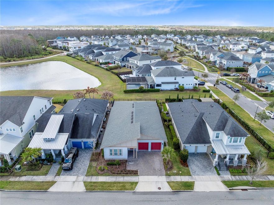 One or more photo(s) has been virtually staged. Welcome to this rare single story Ashton Woods Nobel II model located in the highly sought after Laureate Park community of Lake Nona. Built in 2021, this home offers 2,800 square feet of beautifully designed living space with 4 bedrooms, 3 full bathrooms, a 3 car tandem garage, and a private pool overlooking peaceful water and conservation views. The home blends modern design, open living spaces, and exceptional outdoor living.

The home welcomes you with a spacious gallery style foyer featuring soaring ceilings and natural light, creating an impressive first impression as you enter. Just beyond the foyer, the home opens into a bright open concept living area where the kitchen, dining space, and family room flow seamlessly together, making it ideal for everyday living and entertaining.

The chef inspired kitchen serves as the centerpiece of the home and features a large center island with seating, sleek modern cabinetry, all black stainless steel appliances, and ample counter space for cooking and gathering. A walk in pantry provides generous storage, while the open layout keeps everyone connected whether hosting guests or enjoying a quiet night at home. The adjacent dining area is highlighted by a beautiful designer accent wall, adding warmth and architectural detail to the space.

The primary suite is privately positioned at the rear of the home, offering a spacious retreat, plantation shutters, and plenty of room for a sitting area. The primary bathroom features a long dual sink vanity with abundant storage, a large glass enclosed shower, and a spacious walk in closet designed for easy organization.

Three additional bedrooms are thoughtfully positioned throughout the home. Two of the bedrooms share a convenient Jack and Jill bathroom, while the additional bedroom is ideal for guests, a home office, or flexible living space. The layout provides privacy while still maintaining the open and connected feel that makes this floor plan so desirable.

Step outside to your private backyard oasis, where the covered lanai opens to an expansive brick paver patio surrounding a beautiful custom pool with an integrated spa. The backyard overlooks a tranquil pond with conservation views beyond, offering a peaceful natural setting with no direct rear neighbors. Whether relaxing by the pool, entertaining friends, or enjoying the sunrise over the water, this outdoor space captures the best of Florida living.

Located in the heart of Laureate Park in Lake Nona, residents enjoy access to the community’s exceptional amenities including the Aquatic Center, resort style pools, LP Fit fitness center, parks, playgrounds, and over 40 miles of walking and biking trails. The home is just minutes from Medical City, Nemours Hospital, the VA Medical Center, UCF College of Medicine, the USTA National Campus, Orlando International Airport, and Lake Nona Town Center dining and shopping.

This is a rare opportunity to own a single story pool home with water and conservation views in one of Lake Nona’s most desirable neighborhoods.

Schedule your private showing today.
