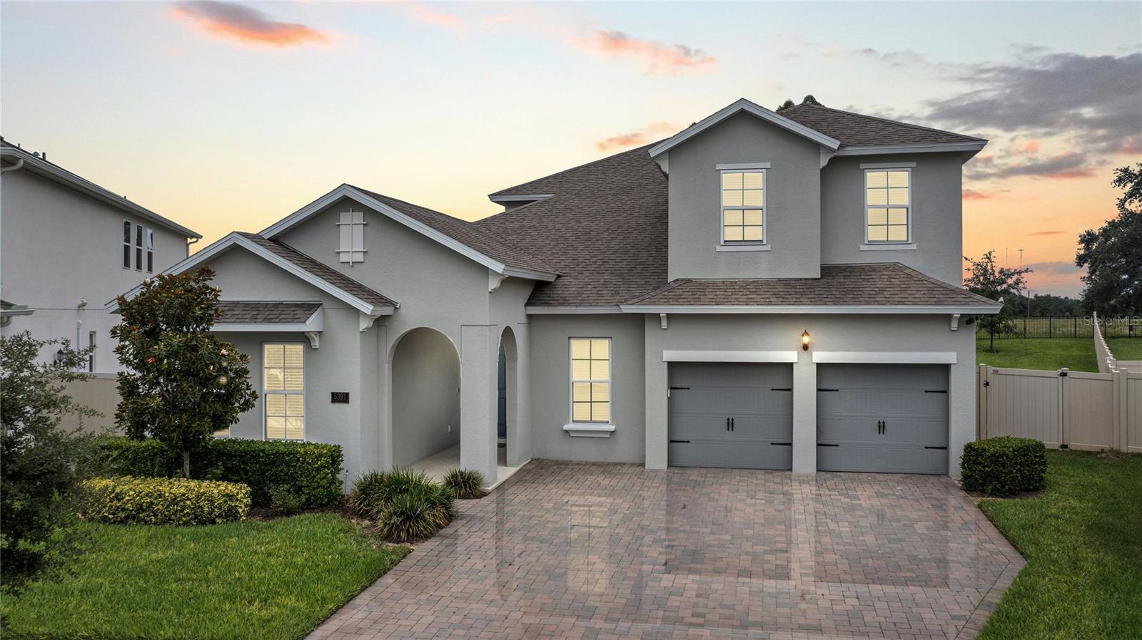 BEAUTIFUL, MOVE IN READY fully upgraded home in Winter Garden’s Wincey Groves! This Dream Finders “Arlington w/Bonus” home sits on one of the largest and most private lots in the entire community, with no rear neighbors and breathtaking sunset views every evening. Boasting 6 spacious bedrooms, 4 full bathrooms, and a large upstairs bonus room with wet bar and space for a wine fridge, this home offers comfort and space for families of all sizes. The oversized 2-car garage includes additional workshop/storage space, a sealed floor, ceiling-mounted storage racks, slatwall organizing system, and a Tesla car charger. Step inside to find 10’ ceilings on the first floor and 9’ ceilings upstairs, a neutral design, and an open-concept layout perfect for modern living. The gourmet kitchen features 42” upper cabinets with crown molding and hardware, quartz countertops, oversized island with breakfast bar, tile backsplash, double ovens, and a custom corner pantry with built-in shelving. The kitchen flows into the family room, where you'll find a built-in entertainment center and cozy fireplace. Slide open the pocket glass doors to your covered, screened-in patio and enjoy the saltwater pool and spa, complete with an ozone generator for water purification and new rock landscaping along the sides of the pool/equipment. It’s an entertainer’s dream and the perfect oasis to sip your morning coffee or wind down at sunset. The private downstairs owner’s suite overlooks the tranquil backyard and includes two closets—one with a permanent safe. The en-suite bath offers a standalone tub, tiled walk-in shower, and dual “adult height” vanity with quartz counters. Also downstairs are three additional bedrooms and two full baths, with one bedroom offering double doors, making it a possible home office or den. Every bedroom, the pantry, under-stairs closet, and office feature custom closet organizers. The custom laundry room provides ample cabinetry and extra storage.Upstairs, enjoy the expansive bonus room, two additional bedrooms, and a full bathroom—perfect for guests, teens, or multigenerational living. Smart features abound: smart thermostats, Arlo doorbell, smart home light switches in the owner’s suite and main floor, hunter douglas blinds, and automated smart blinds on the downstairs slider and bonus room. Ideally located in the heart of Hamlin, you’re just minutes from major highways, theme parks, and top-tier shopping and dining. No need to wait to build —this upgraded, rare-lot home is available now. Don't let this gorgeous and spacious home pass you by!