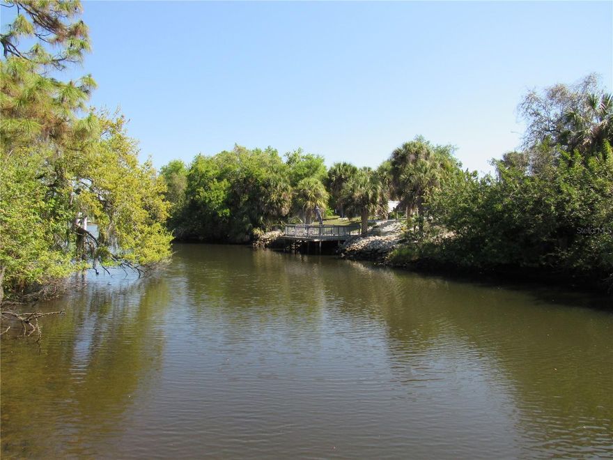 This waterfront duplex, with gulf access, has all the luxury high quality upgrades you are looking for! Built in 2020, both units are being sold together.  Each has 2 bedrooms, 1.5 baths, a one car garage and have private screened lanais and porches.  This is a unique investment opportunity. Live in one and rent the other or use as short term rentals or long term lease properties. There are no HOA fees here and no rental restrictions.  Enoy relaxing, or fishing, from the 30 foot TREX dock overlooking the water or enjoy the serene water view from the 30 foot, screened lanai from the back unit (#2076). The entire duplex features beautiful porcelain wood-look tile throughout plus travertine tile on the private lanais and covered porches.  Each unit has 1.5 baths, with the main baths having shower/tub combinations with jetted tubs.  The open floorplan is perfect for entertaining.  The kitchens feature 42"solid wood cabinetry, granite counters, tiled backsplash and upgraded stainless appliances.  There is no common wall between the 2 units...the garages separate both.  For peace of mind there are IMPACT WINDOWS and there is blown in insulation in the attics providing additional savings for utility costs.  Each unit has its own water and electric meter.  Even the landscaping has been meticulously maintained as have both the inside and exteriors of each unit.  All this with easy access to shopping, dining, golf courses, medical facilities and located just minutes from historic downtown Punta Gorda, Warm Mineral Springs, Boca Grande and the beaches on Manasota Key.   Whether you are looking for a vacation home, short term rental income property or long-term lease property, you won't want to miss the opportunity to own this meticulously maintained duplex with all those possibilities.