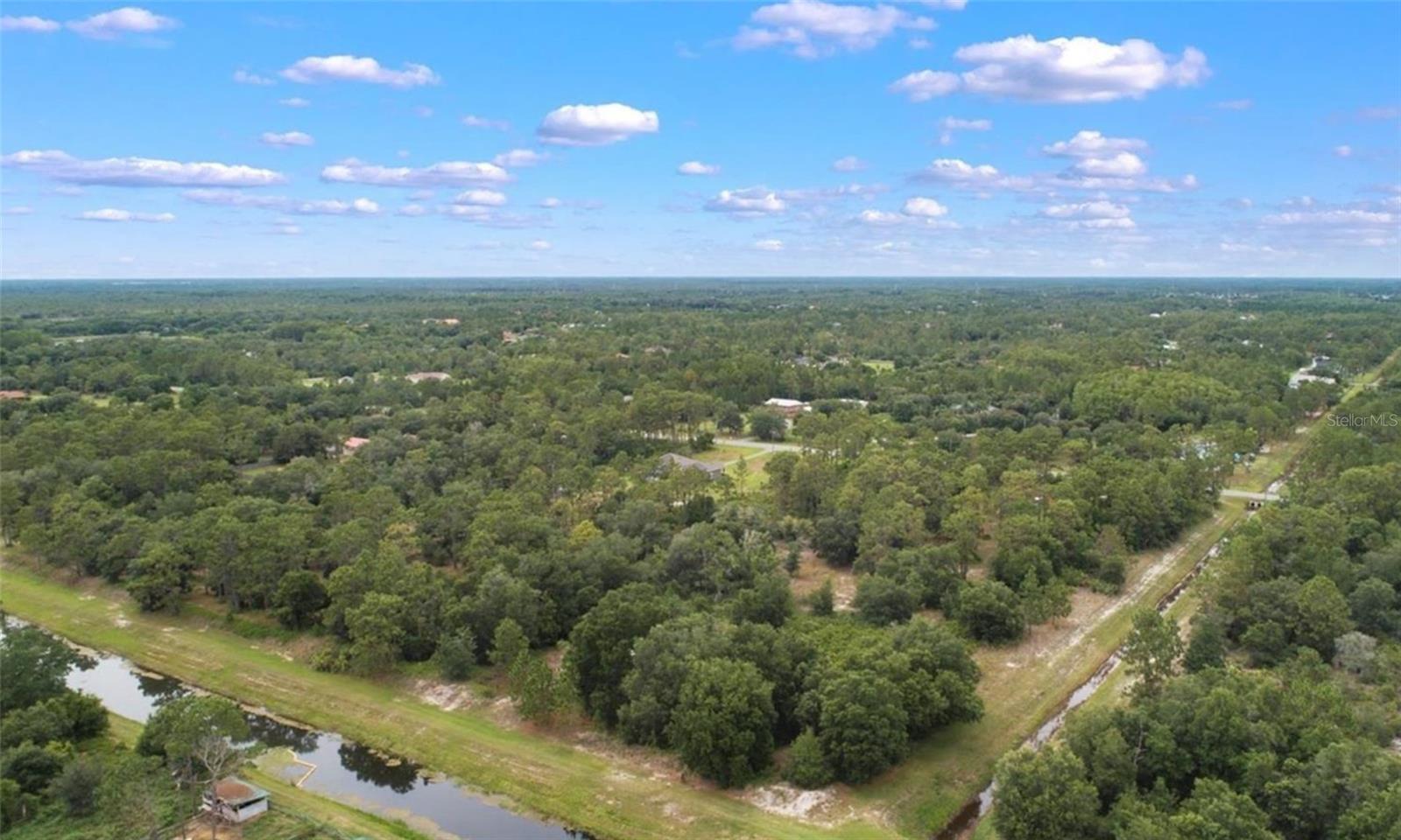 100% dry lot! Discover this exceptional 2.59 acre lot located in the sought after Wedgefield community of Orlando. This unique property starts with a 105' frontage and expands into a spacious 255' wide lot offering ample room to build your dream home. Do not miss this opportunity to own over 2 acres of 100% dry land. Buyer responsible for due diligence.