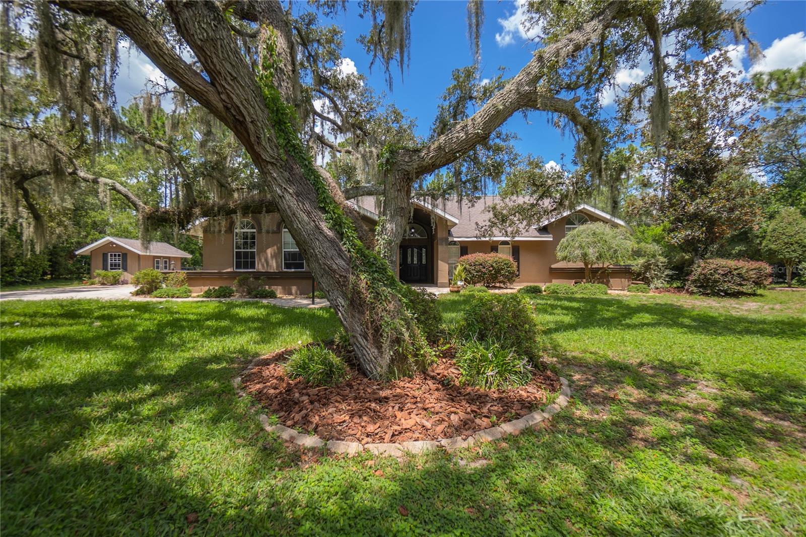 Nestled on a beautiful one-acre parcel in the desirable, deed-restricted community of Pine Ridge, this spacious 5-bedroom, 3.5-bathroom home offers 3,654 square feet of living space matched with a 3-car garage. Home is well suited for an entertaining lifestyle, large families or accommodating multigenerational living. The interior presents a beautiful, updated kitchen boasting wood cabinetry, granite countertops, stainless steel appliances, and pantry. The well-designed split floor plan includes a formal dining room, a flex room, interior laundry equipped with washer & dryer, sizeable living and family rooms complete with a wood-burning fireplace, updated guest bathrooms/half bath, and triple pocket sliders that open seamlessly to the pool area. The primary suite features a fully remodeled bathroom and includes dual sinks w/quartz countertops, soft close cabinets, expansive shower, and walk in closet. The exterior features an inground caged pool with a tranquil waterfall, paver decking, and a covered outdoor entertaining area. Additional highlights include a whole-house generator, a 12x16 storage shed, rear fenced yard with double gates and a private well for irrigation.
