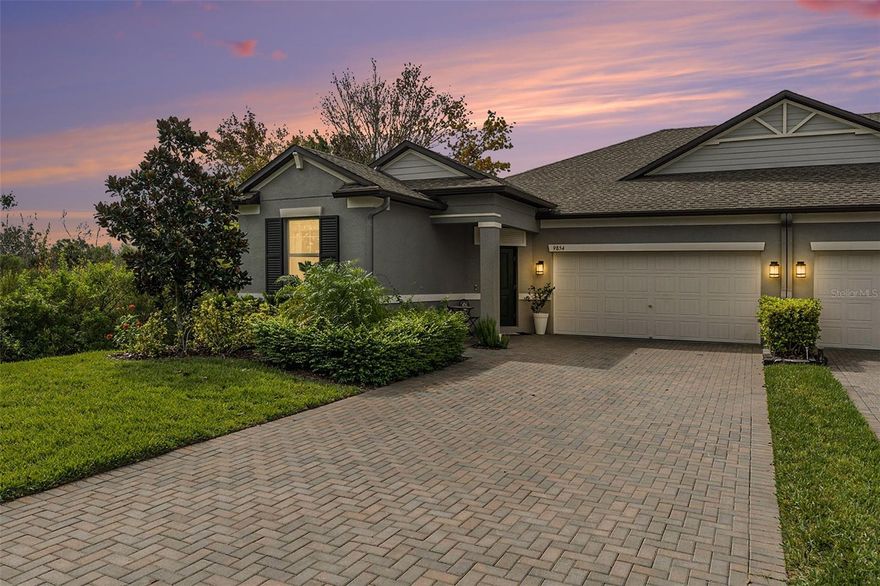 MAINTENANCE FREE! Charming Move in Ready, Single-Story Villa on one of the most stunning homesites. Step into luxury with the Inkwood floor plan featuring 1,968 sq. ft. of perfectly appointed living space, offering 3 bedrooms, 2 bathrooms, a 2-car garage, & a covered enclosed lanai with breathtaking views of a tranquil pond & conservation.  Nestled in the highly sought-after Connerton Community, this home promises both serenity & sophistication. From the moment you arrive, the paved driveway and stately 8 ft. entry door set the tone for elegance. Step inside the spacious foyer, where soaring ceilings, crown molding throughout, and upgraded tile flooring in all main living areas & wet rooms create an air of refined comfort. To the left of the foyer, you'll find two generously sized bedrooms with ceiling fans and custom curtains. The full bathroom features a shaker cabinet vanity with quartz countertops, plus a private shower and water closet combination, ideal for multi-person use. At the heart of the home lies the open concept living space perfect for entertaining. The gourmet kitchen is a chef’s dream, showcasing quartz countertops, sleek slate appliances, shaker cabinetry, an oversized island perfect for gathering with friends & family, seamlessly flowing into the living & dining areas. The dining area features custom floor to ceiling curtains, a decorative light fixture and is open to the kitchen & living area perfect for gathering with friends and family.  The grand room features a ceiling fan and sliding glass doors with floor to ceiling curtains, highlighting the picturesque view of the pond.  Retreat to the private primary suite, tucked away at the rear of the home for ultimate relaxation. This serene sanctuary boasts stunning pond views, creating the perfect escape. The spa-like ensuite is a masterpiece of luxury, complete with double vanities, a tiled walk-in shower, and expansive walk-in closet. Step outside through the sliding glass doors onto the screened & covered lanai, where you can unwind & soak in the tranquil pond views an idyllic setting for your morning coffee or evening gatherings. Additional features include a 2-car garage, extra-large closets, & a dedicated laundry room with a convenient mail drop zone that can also serve as a stylish coffee station. HIGHLIGHTS: low-maintenance lifestyle, HOA fees cover EXTERIOR LAWN CARE, IRRIGATION, WATER, STRUCTURAL/EXTERIOR INSURANCE INCLUDING ROOF.  Connerton is more than just a neighborhood; it's a vibrant, resort-style community designed for those who love both nature & modern amenities, Connerton features picturesque nature preserves with scenic bike trails, lakes, and wetlands, all seamlessly integrated with resort-style living. The community’s world-class lifestyle center includes a resort-style pool, splash park, temperature-controlled lap pool, state-of-the-art fitness center, beach volleyball, basketball, and tennis courts, along with a packed social calendar filled with activities for all ages. Residents enjoy top-rated schools, with Connerton elementary school & Pinecrest Academy on sight.  New state of the art clubhouse is also under construction, promising an additional resort-style pool, fitness center, and six pickleball courts.  Connerton offers the perfect blend of relaxation and recreation, making it one of the most desirable places to call home. Coming soon...Ridge Rd extension to US 41 Spring 2026