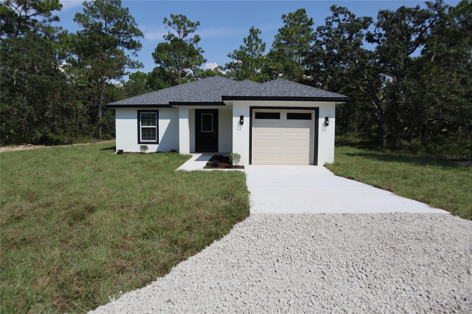 This inviting new construction home offers a practical floor plan, brand-new systems, and a clean, modern look perfect for first-time buyers or anyone seeking worry-free living. Featuring 3 bedrooms, 2 bathrooms, and a 1-car garage, the home sits on a spacious 0.46-acre lot at the end of a quiet dead-end road. The open-concept kitchen comes fully equipped with a complete set of appliances, making meal prep and entertaining a breeze. The master suite includes a private bathroom and a very spacious walk-in closet. With its fresh design, efficient layout, and peaceful location, this home is move-in ready and waiting for its first owner.
