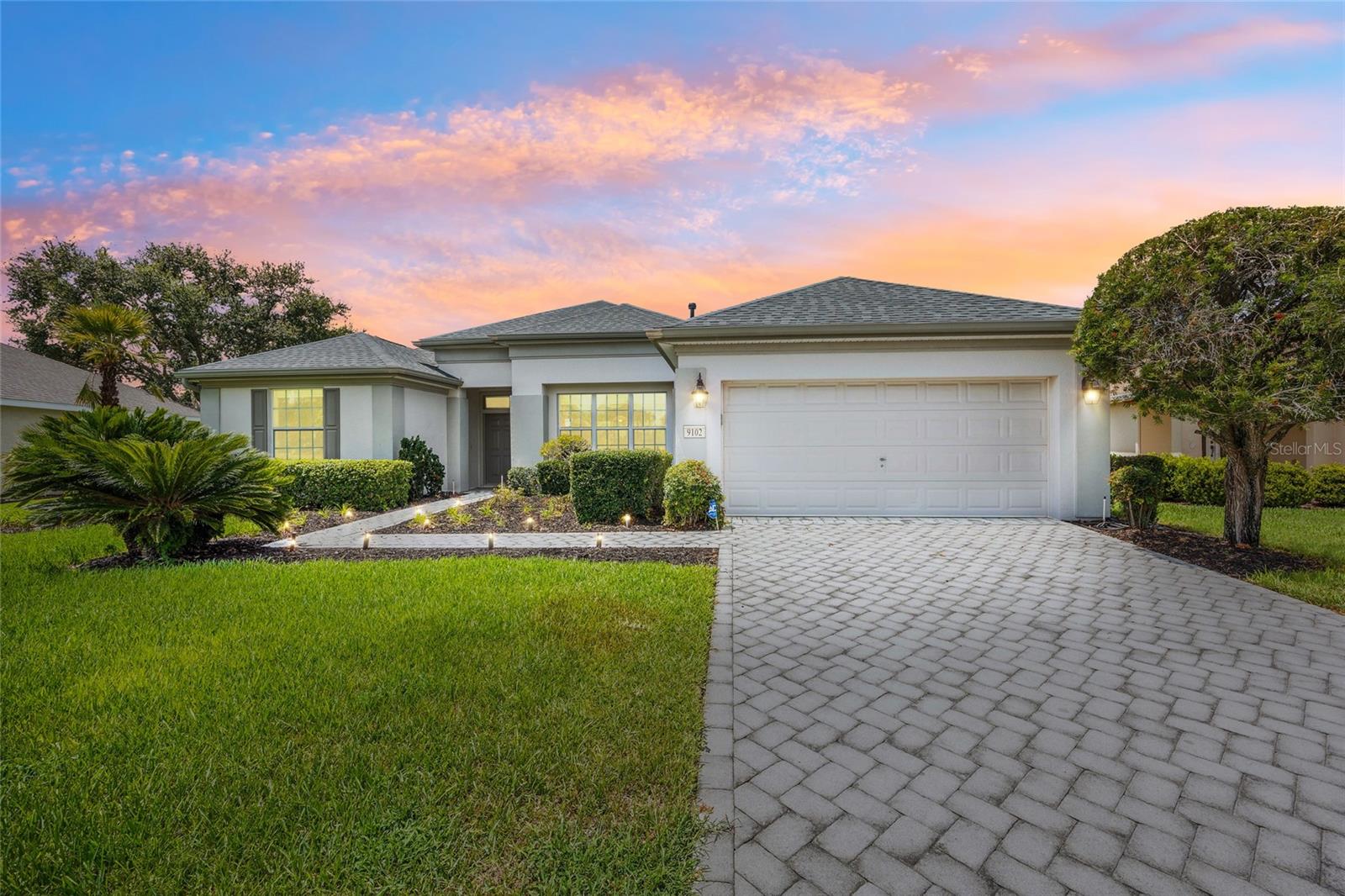 Located on the Masters Golf Course in the sought-after Windward Hills section of Del Webb Spruce Creek Country Club, this well-maintained Fairmount model offers comfort, style, and incredible golf course views in one of Central Florida’s premier 55+ communities. This 2-bedroom, 2-bathroom home features carpet in the bedrooms and living area, with tile throughout the kitchen and bathrooms. The kitchen is equipped with newer appliances, granite countertops, and offers plenty of space for entertainment. The large primary suite includes a custom walk-in closet and a luxurious bathroom with a soaking tub and Roman-style walk-in shower. Recent updates provide peace of mind, including a new roof installed on 7/8/25, a 4-year-old AC unit, and a hot water heater installed in 2016. The home also includes a full-house natural gas generator, an extended lanai with an outdoor patio area perfect for relaxing or hosting guests and comes with a 2007 Yamaha golf cart. Interior walls were repainted five years ago, adding a fresh and inviting feeling throughout. With resort-style amenities and scenic fairway views, this property truly embodies the Florida active adult lifestyle.