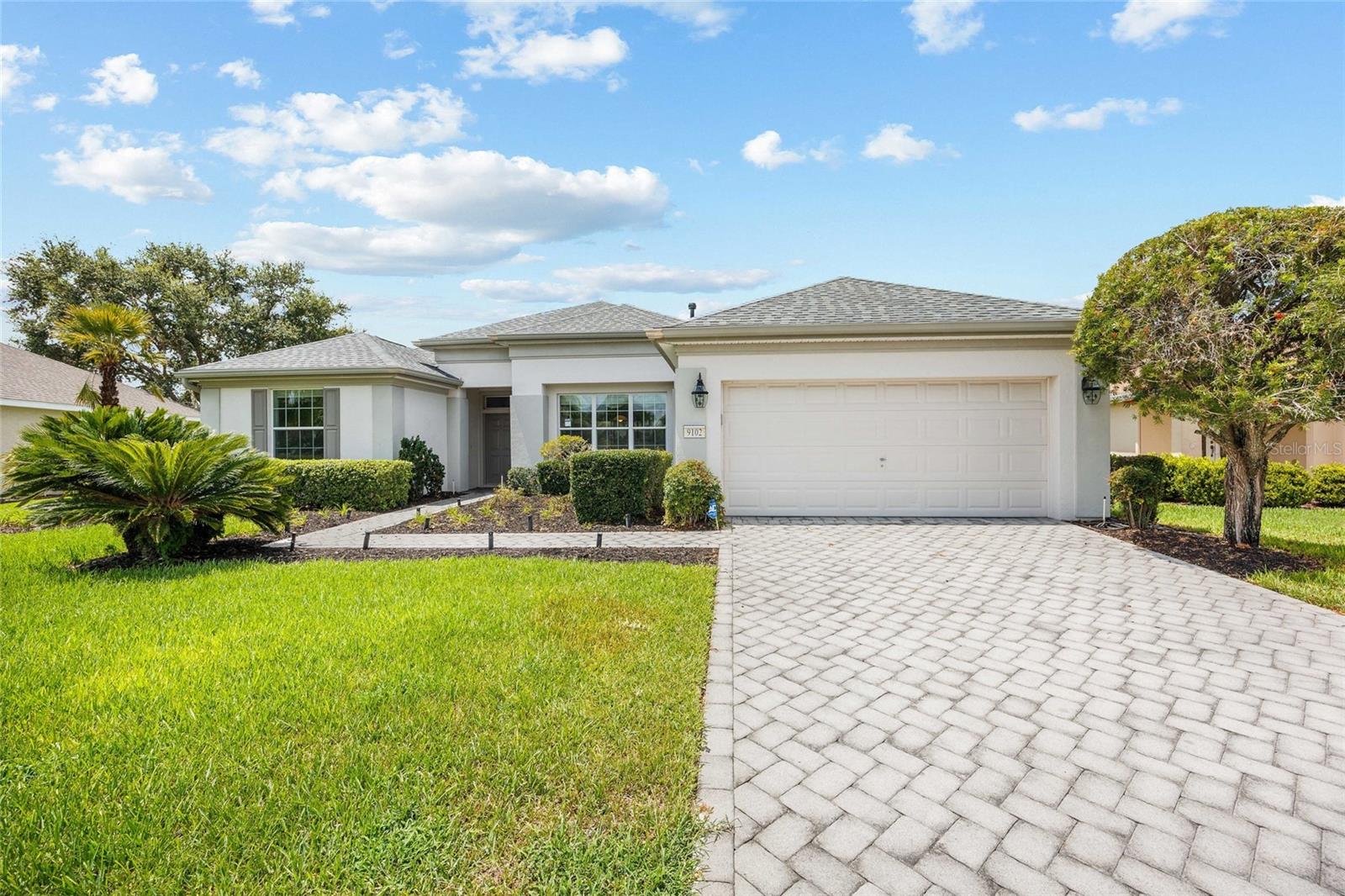 Located on the Masters Golf Course in the sought-after Windward Hills section of Del Webb Spruce Creek Country Club, this well-maintained Fairmount model offers comfort, style, and incredible golf course views in one of Central Florida’s premier 55+ communities. This 2-bedroom, 2-bathroom home features carpet in the bedrooms and living area, with tile throughout the kitchen and bathrooms. The kitchen is equipped with newer appliances, granite countertops, and offers plenty of space for entertainment. The large primary suite includes a custom walk-in closet and a luxurious bathroom with a soaking tub and Roman-style walk-in shower. Recent updates provide peace of mind, including a new roof installed on 7/8/25, a 4-year-old AC unit, and a hot water heater installed in 2016. The home also includes a full-house natural gas generator, an extended lanai with an outdoor patio area perfect for relaxing or hosting guests and comes with a 2007 Yamaha golf cart. Interior walls were repainted five years ago, adding a fresh and inviting feeling throughout. With resort-style amenities and scenic fairway views, this property truly embodies the Florida active adult lifestyle.