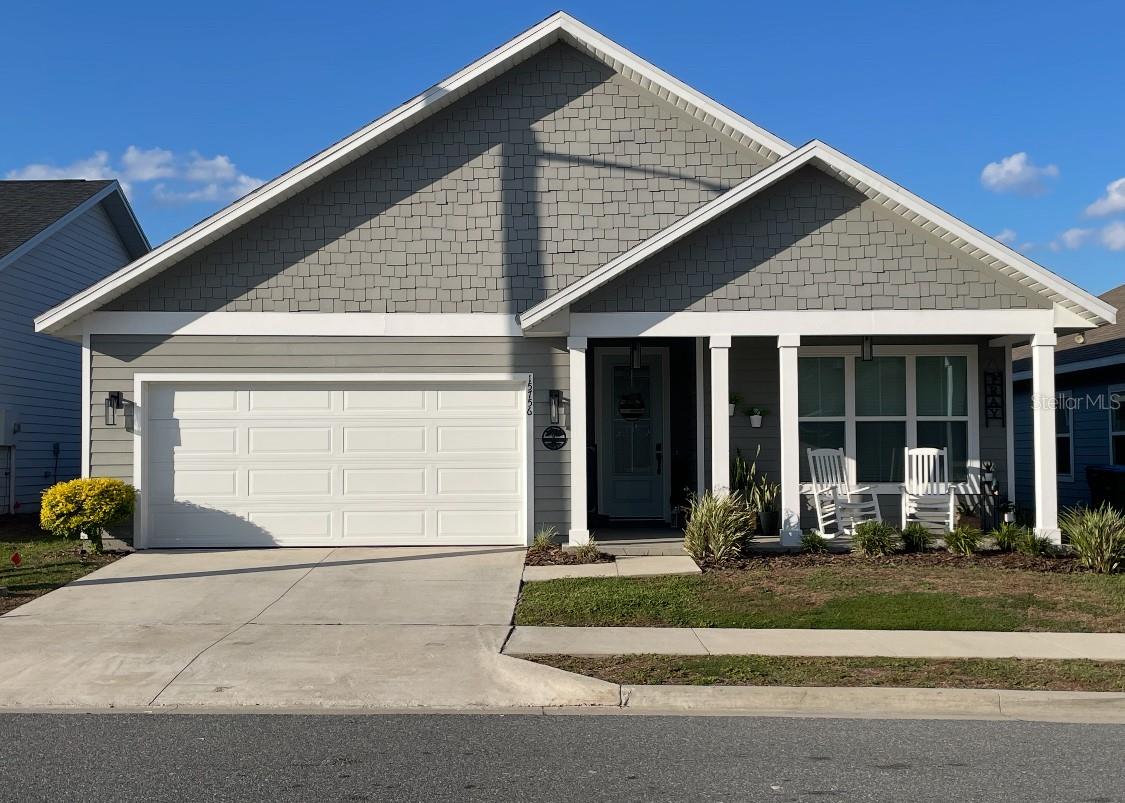 This is a beautiful 3/2 home that has been cared for by owners. It has luxury vinyl plank floors, exquisite counter tops in kitchen and both bathrooms. It has beautiful shaker cabinets with soft close. Elegant features throughout the house! and beautiful front and back porches to enjoy morning or evening coffee. All common areas have luxury vinyl plank flooring. THIS BEAUTIFUL HOUSE BACKS UP TO A BEAUTIFUL GREEN AREA. Community pool being built.