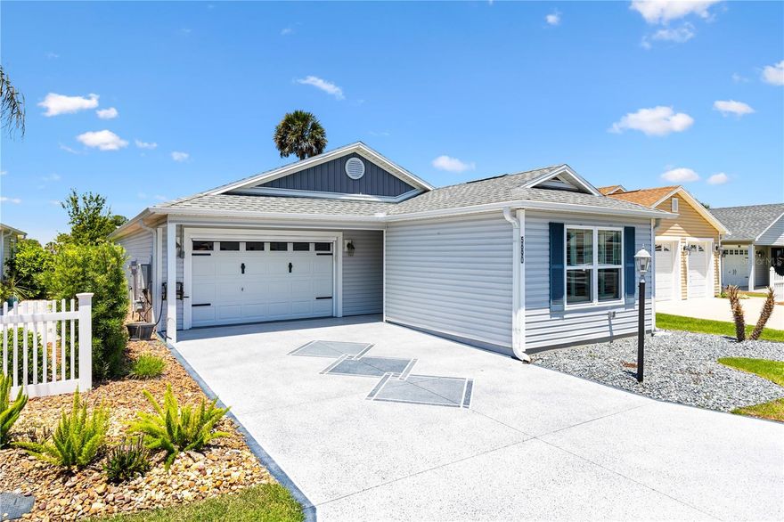 Welcome home to this beautifully maintained Onyx Patio Villa in the Village of Fenney. 2 bed 2 bath gem offers a perfect blend of modern style, peaceful water views, and low-maintenance living.

From the moment you arrive, you'll notice the inviting curb appeal with crisp exterior colors, decorative shutters, and a spacious driveway leading to the oversized garage. The garage has epoxy floors, an electric screen and an EV Charger. The landscape is clean and easy to maintain, giving the home a fresh, move-in-ready feel.

Step inside to discover a bright open-concept floor plan filled with natural light, soaring ceilings, and gorgeous wood-look flooring throughout the main living areas. The stunning kitchen is truly the heart of the home, featuring bright cabinetry, Stainless Steel appliances with a gas stove, abundant quartz countertops and a large center island perfect for entertaining guests or casual everyday dining.

The spacious screened lanai has a motorized shade, a tile floor with a tranquil water views and lush greenery. Whether you are sipping morning coffee, reading a book, or hosting friends for sunset cocktails, this peaceful retreat will quickly become your favorite spot in the home.

Designed for comfort and convenience, this home offers 2 generously sized bedrooms, a custom main bedroom closet and a built in Murphy bed in the 2nd bedroom. The bedrooms have modern finishes, and an easy flow layout ideal for both full time living and seasonal enjoyment.

If you've been searching for a home that combines updated style, serene views, and carefree Florida living, this one deserves a spot at the top of your list. Homes with this kind of setting and presentation don't stay available for long.